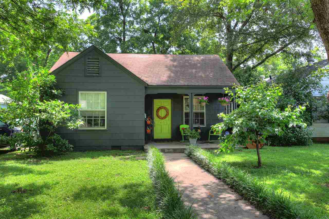Charming Park Hill home/bungalow that is move in ready. Very cute exterior sitting on level lot with large back yard. Inside, the home features hard wood flooring, dining room, 2 nice size bedrooms & a totally remodeled bathroom. Cute kitchen with electric range and dishwasher. Laundry room with built in desk and closets. Detached garage with electric and water serves as extra storage but could be converted back to garage. Roof about 5 yrs old, hwh about 3 yrs. Yard has peach and pecan trees. A must see!