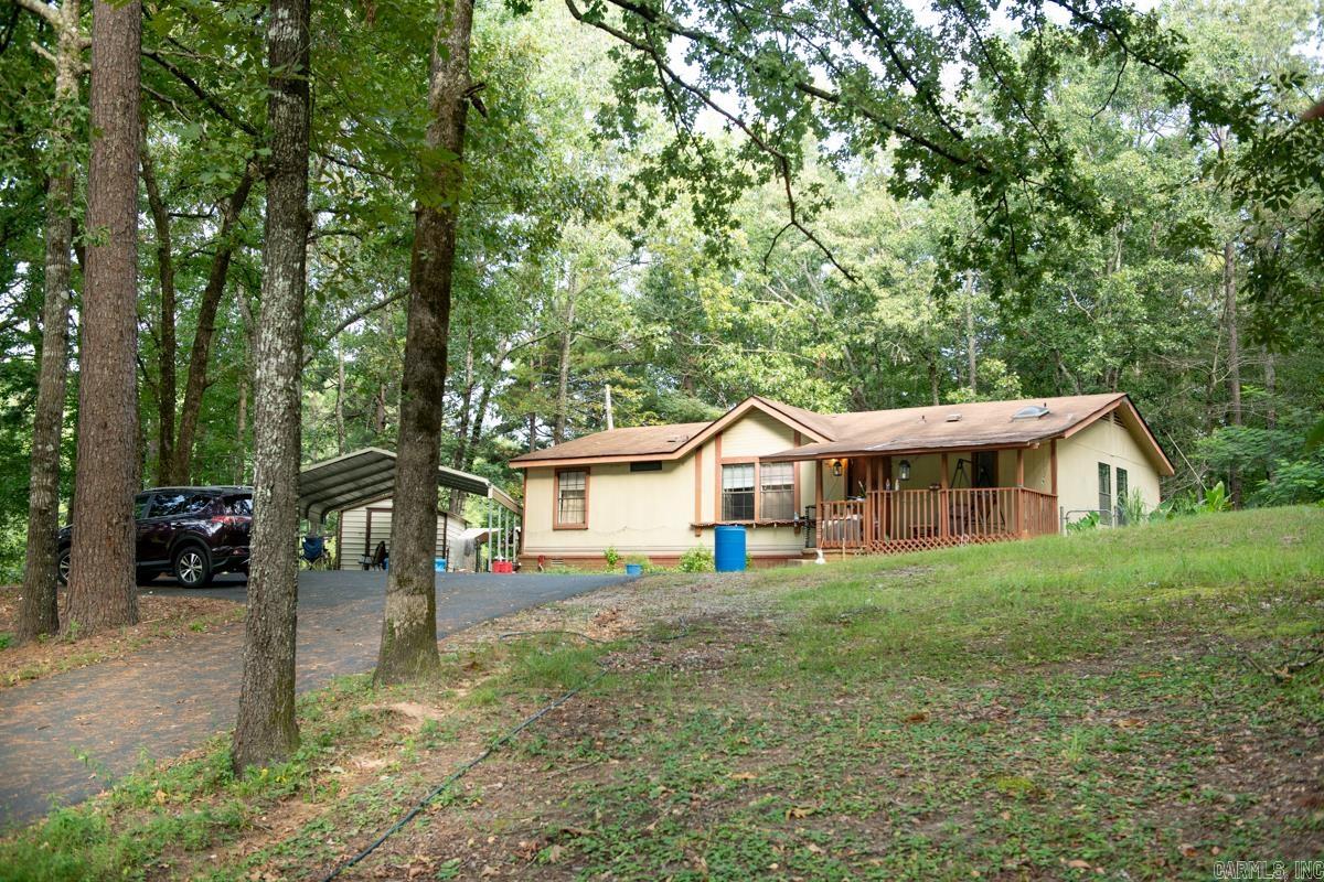 3 BR 2 BA sitting on 1.74 acres right on Lake Sandy. Private** Shed** paved driveway.  Open porch and two wood decks. Come look today!