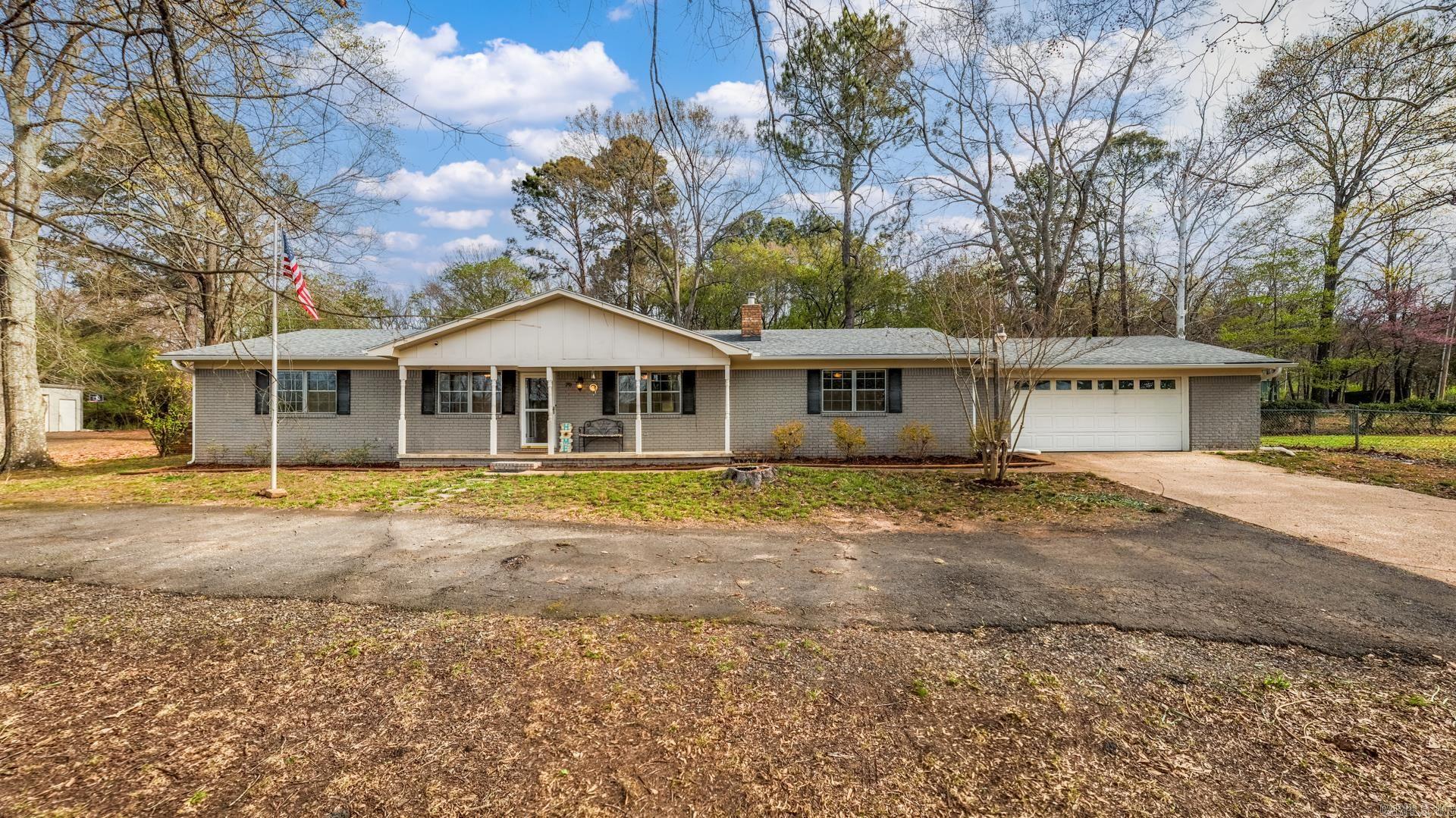 Welcome to 70 Beaverfork Road in Conway, Arkansas, a rare opportunity to own a home in a community that offers a private access to Beaverfork Lake for homeowners on 1.66 acres with a shop! Home buyers searching for homes near Beaverfork Lake in Conway AR will appreciate the peaceful setting, lake views, and outdoor lifestyle this property offers. This 3 bedroom, 2 bathroom home features light, updated finishes, painted brick, and two living areas that give you flexibility for entertaining or everyday living. Many updates include: NEW interior paint, NEW dishwasher, NEW flooring in living room, NEW HVAC (3 yrs), NEW front & back gutters, several trees cut down and septic pumped (2 yrs). Outside, enjoy a spacious yard, covered front & back porches, circular driveway and 20x30 shop perfect for storage, hobbies, or workspace. Take in views of Beaverfork Lake across the street from your front door and enjoy private access to the park & boat dock. Fiber internet is included. Located in one of Conway’s most desirable neighborhoods, this property combines space, comfort and lake access in a way few homes do. Schedule a showing today and see why this home stands out. Agents see remarks.
