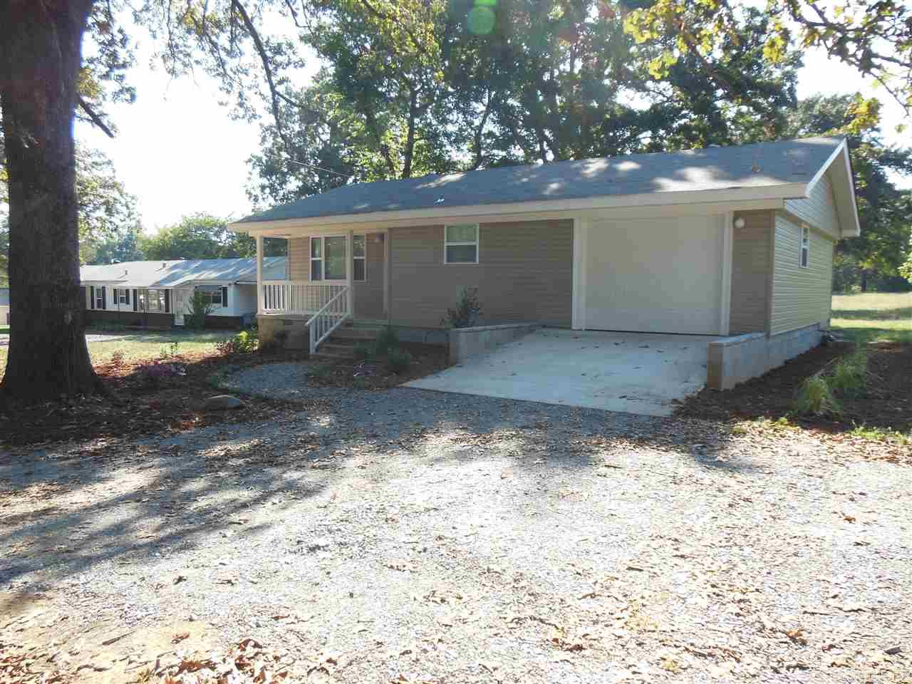 UPDATED COUNTRY LIVING!! Nicely painted 3 bedroom home, 2 super nice bathrooms, hardwood/ceramic tile floors, updated kitchen, all appliances furnished, center island, granite countertops, laundry room, HVAC, private deck, garage with extra storage on a large lot with circular drive. CALL Marshall Peters & Associates 501-414-8340