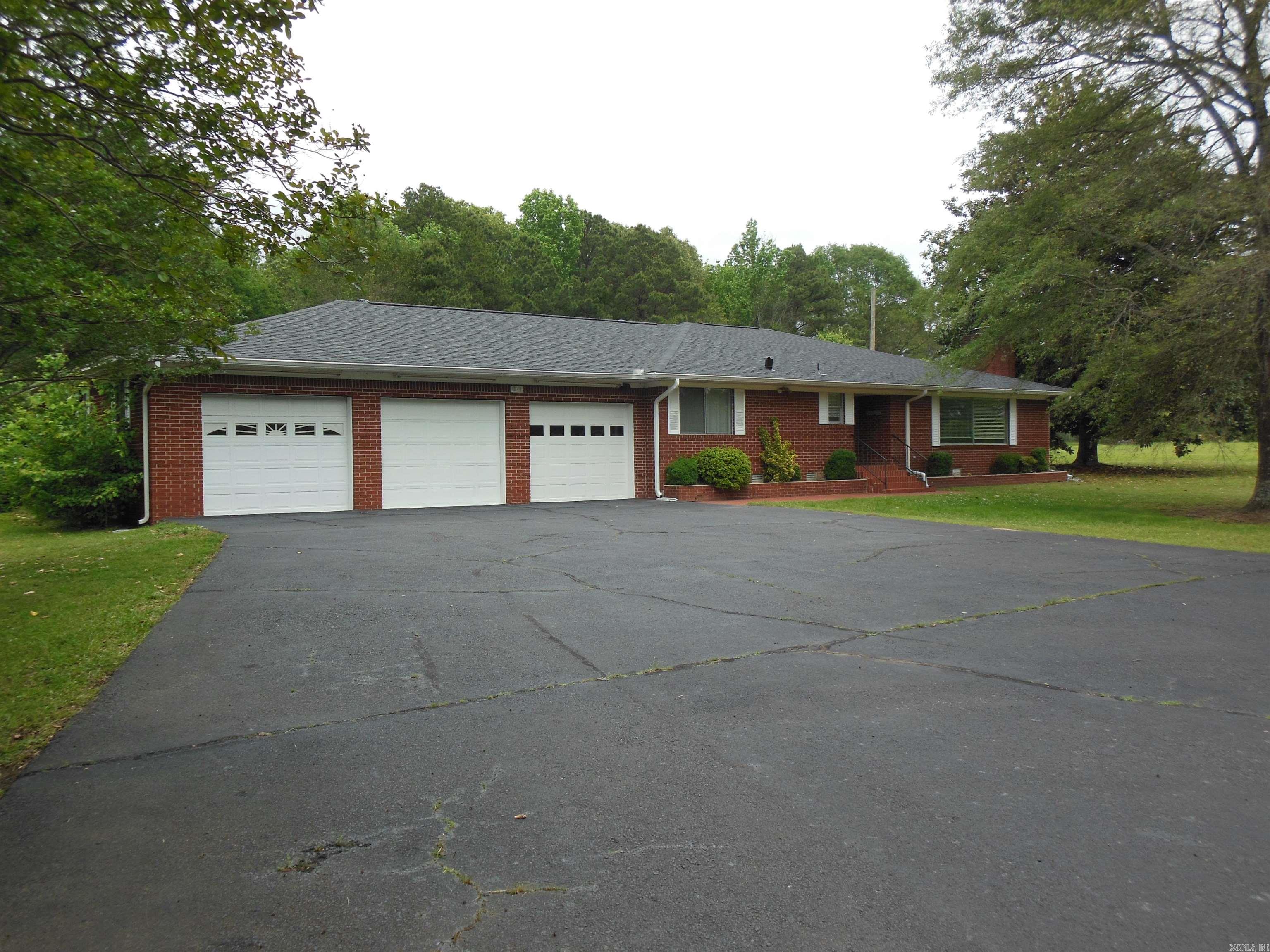 Room to Roam Here! This property features include 5 level acres close to town and the Malvern Country Club, large kitchen with stainless appliances, formal living room, three car garage, home generator, new roof in 2026, two shops and a large driveway for all the cars! Don't miss seeing this one!
