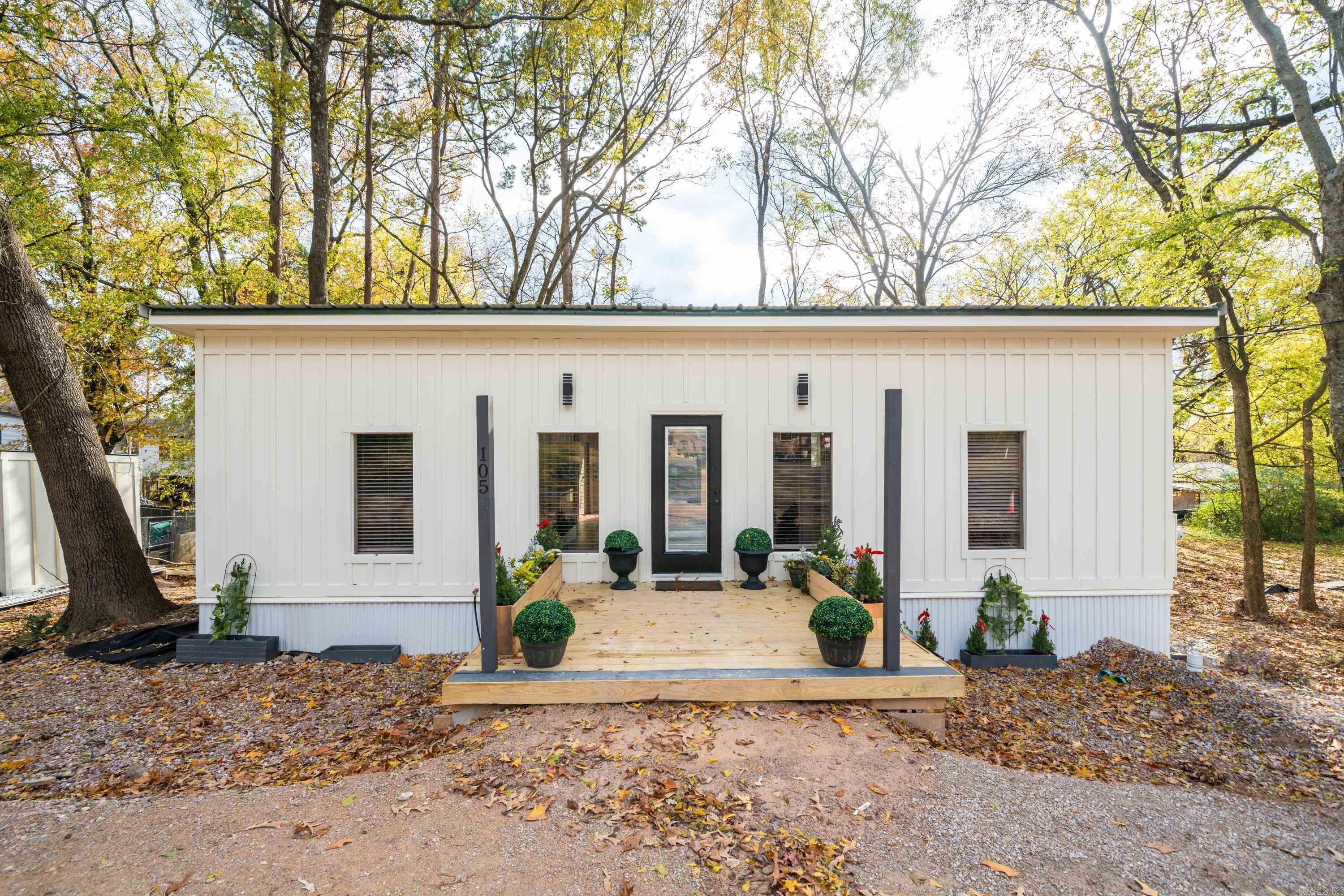 This new construction home is nestled on 2 lots along a quiet street close to shopping and dining. This modern 2 bedroom 2 bathroom has been constructed with some unique, desirable features such as butcher block counter tops, electric fireplace, 3 mini splits  to allow you to heat/cool only the parts of the home you wish, open shelving, and tall ceilings. Main bedroom has 3 closets and a vanity/desk for plenty of storage. All brand new appliances convey and seller is offering a  year builders warranty.  This home is in the final stages of construction so listing photos may not reflect updated work.