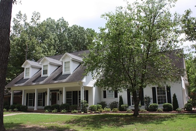 Beautiful custom built home in great condition.  Has hardwood and terra cotta tiles downstairs.  There is no carpet in the house.  Master bedroom downstairs, big kitchen with wonderful natural light throughout.  Separate den and living room and dining room.  Upstairs are 3 bedrooms, 2 bathrooms and an office or playroom.  Great price for a wonderful family home!  Freshly painted interior and brand new hot water heater.