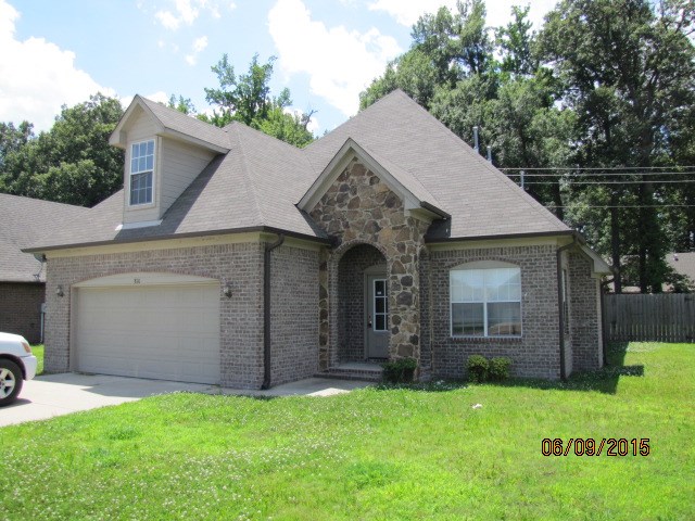 Large 4 bedroom 2.5 bath brick home near Marion Golf Course has style, functionality and plenty of room! 1747 Sq. Ft. heated and cooled. Master suite downstairs. Acid stained downstairs. Open floorplan with lovely custom kitchen. Half bath and laundry room are on ground floor. Living area with GLFP. 3 additional bedrooms upstairs with 2nd full bath, and a fair sized open living area beside the stairs. 2 car attached garage with storage room. Rear patio with privacy fencing. Dual AC units. Security system.