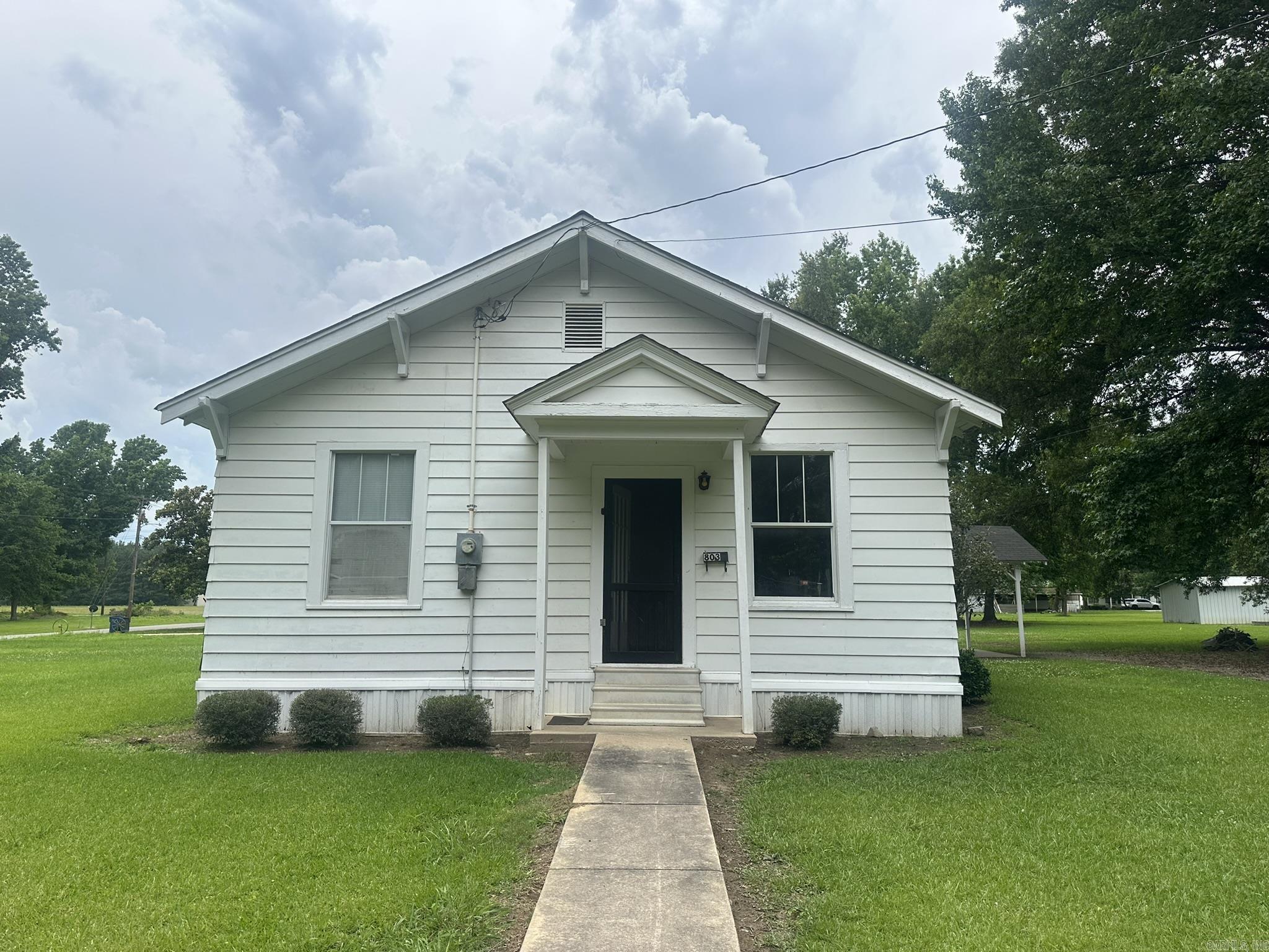 This home is located in Hamburg, AR on a corner lot - Built in 1950, 1,392 square feet.  Two bedrooms and one full bathroom with a large room on the back that would make a nice 3rd bedroom (half bath attached).  Large living room with hardwood floors.  One car carport - .29-acre lot.  Lots of potential!