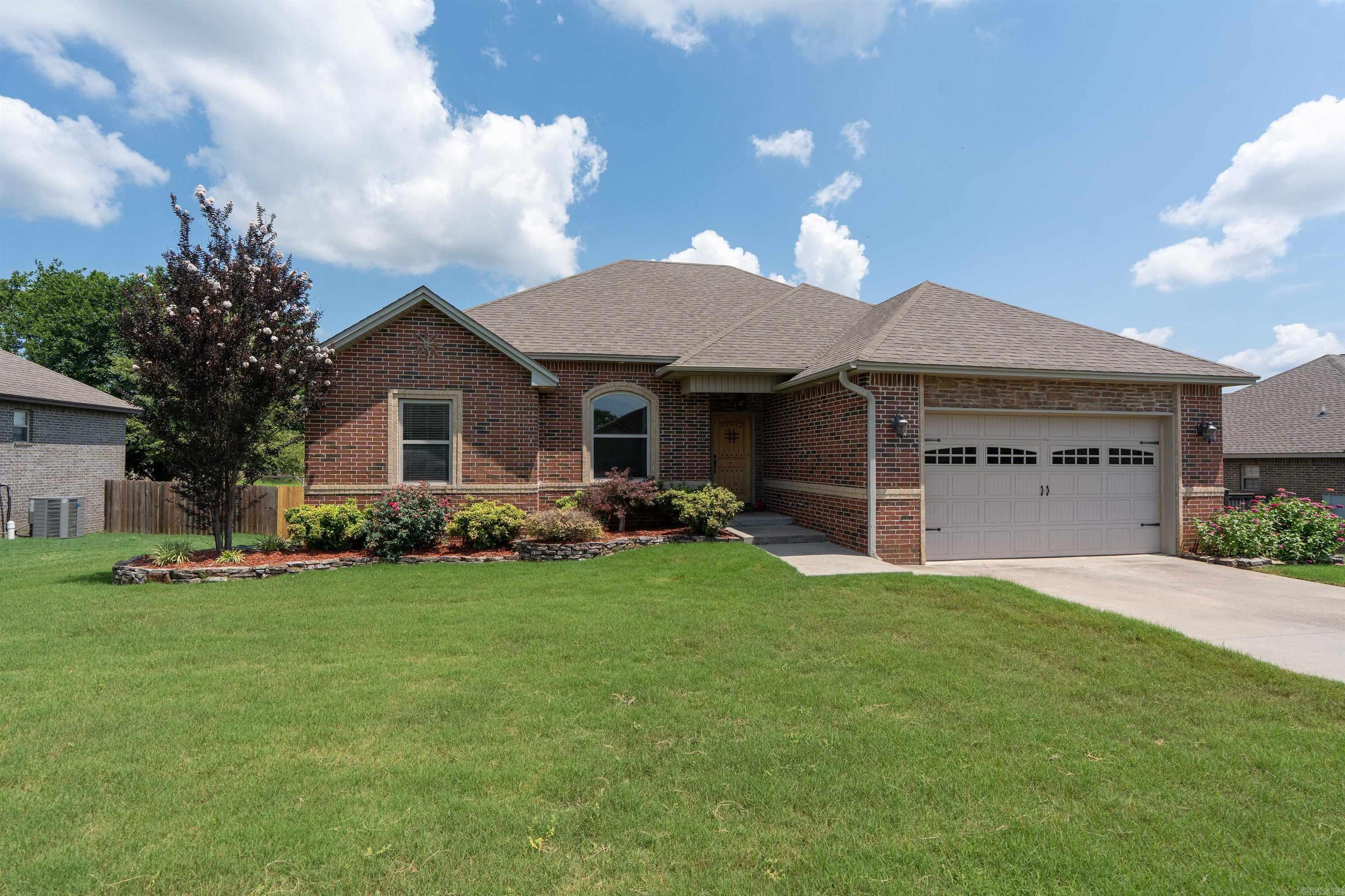 Perfect 4-bedroom home has just hit the market! This beautiful split floor plan offers the perfect combination of privacy, comfort, & functionality. Step through the foyer into the inviting living room featuring a cozy gas fireplace, hardwood floors, vaulted ceiling, recessed lighting, abundance of windows that fill the space w/natural light. Kitchen is designed for everyday living & entertaining w/a gas stove, plenty of granite countertop space, abundant cabinetry, a convenient breakfast bar. The dining area is located just off the kitchen, making meals & gatherings a breeze. Laundry room has room to spare? It offers generous floor space, ample cabinetry, plenty of storage. The spacious primary suite features a vaulted ceiling, brand-new carpet, large walk-in closet, & incredible bonus—a safe room! The en-suite bath includes a jetted tub, large custom-tiled shower, double vanity. On the opposite side of the home, you'll find three additional bedrooms, all generously sized w/great closet space. Step outside to enjoy the fenced backyard complete w/a multi-level deck, perfect for relaxing or entertaining. Don't miss the semi-finished basement w/exterior access- Multi purpose space!
