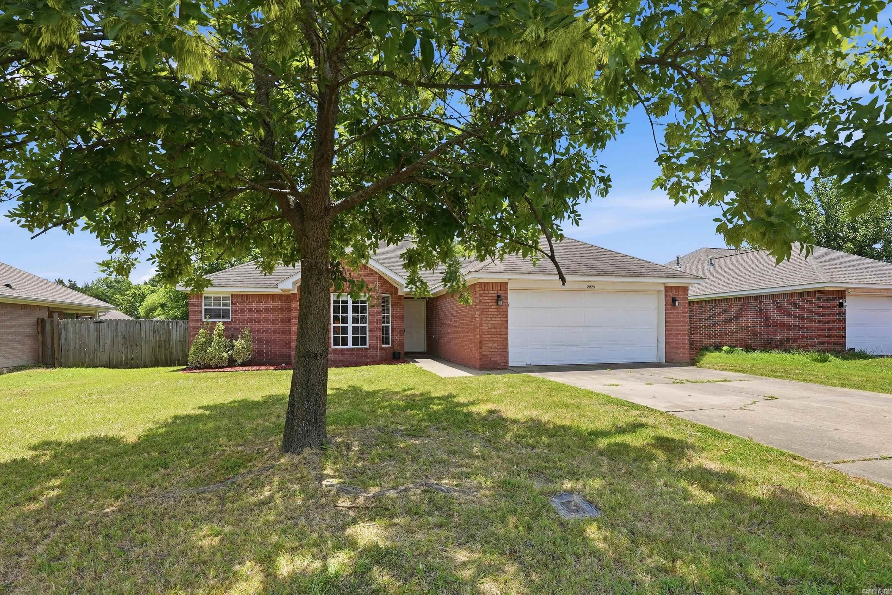 Welcome home to this beautifully maintained, all-brick, one-level home offering 1,553 square feet with 3 bedrooms, 2 bathrooms, and a bright sunroom with a vaulted ceiling. The desirable split floor plan provides added privacy, while French doors off the living room lead to the inviting sunroom.  The spacious kitchen features abundant cabinet and counter space and opens to the dining area with a large bay window and tray ceiling. The primary suite includes dual vanities, a jetted tub, separate shower, and two walk-in closets.  Enjoy the large fenced backyard, perfect for relaxing or entertaining. This home is served by Conway Corp utilities.  Conveniently located near restaurants, shopping, schools, and everyday amenities. Schedule your showing today!