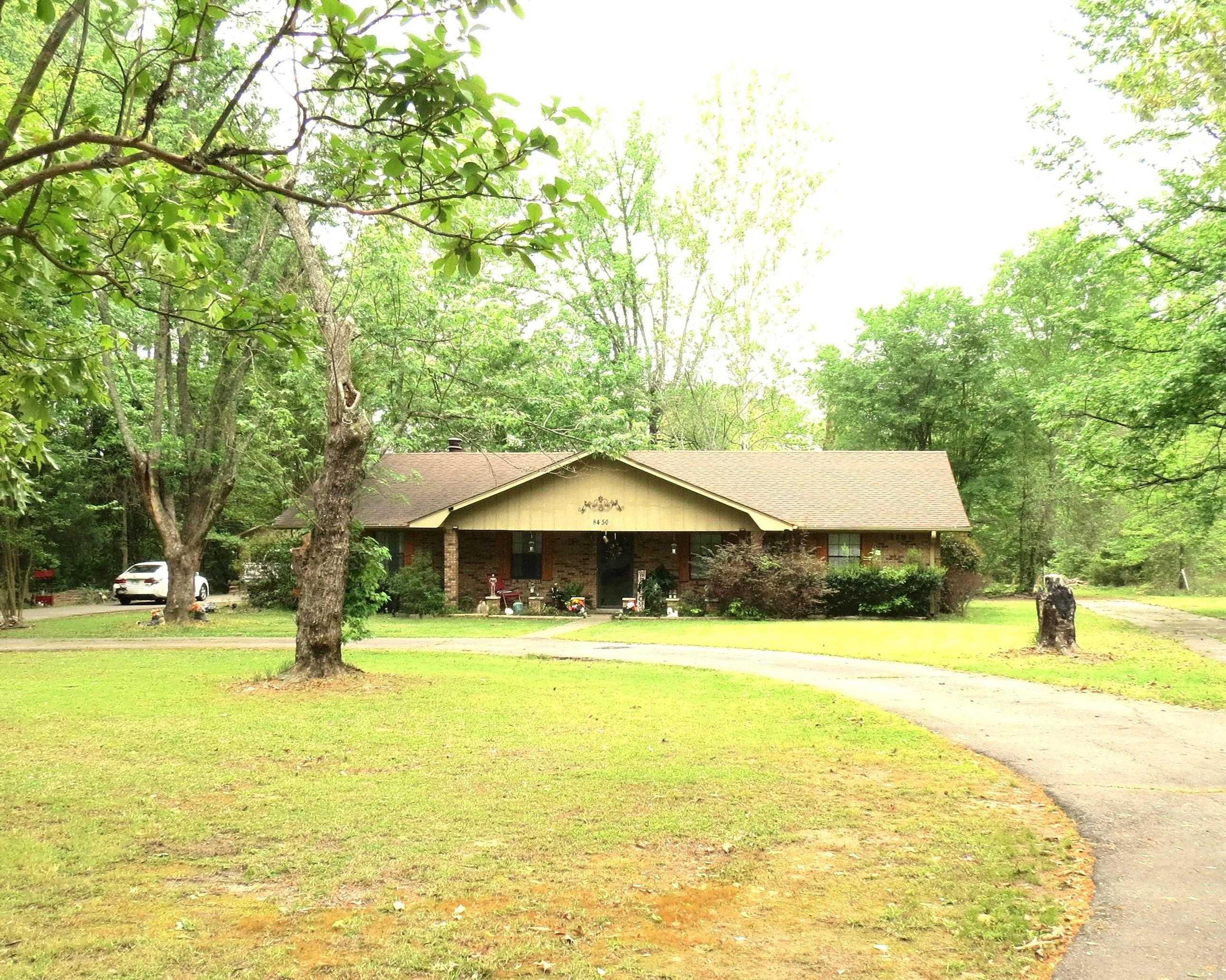 Great area South of Pine Bluff.  This brick home has 3 bedrooms, 2 baths, dining room, wb fireplace, laundry room has a sink.  Bonus room with private entrance was used as a beauty shop.  This has so many possibilities to be used as a studio, craft room, man cave, second living area, office, etc.  Detached garage.  Deck off the back is a great place to enjoy your coffee and watch nature..  Circle drive in front of the home.  The home sits on 2 acres.  Taxes are after Homestead Credit!  Call today to find out about a loan with no down payment, and to schedule your viewing!!