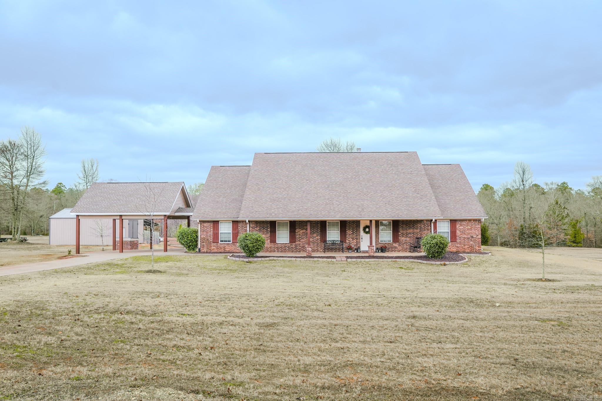 Looking for a 4-bedroom home in the Genoa School District with a shop? This move-in-ready home in the highly desirable Creekwood subdivision offers space, comfort, and functionality for everyday living. The large living area features two entry closets and a cozy double-sided fireplace, while the open kitchen includes an island with bar seating, granite countertops, stainless appliances, and a bright breakfast area. The split floorplan provides privacy, highlighted by a spacious primary suite with a large bedroom, spa-style bath with shower, jacuzzi tub, double sinks, and a walk-in closet. Three additional bedrooms offer flexibility, including two “Jack and Jill” style rooms with their own vanities and closets, plus a third bedroom tucked into a separate hallway—perfect for guests or a home office. Enjoy the covered front porch, covered back patio, and a large fenced backyard ideal for pets, play, or entertaining. The property also includes a two-car carport with floored attic storage and a 24x30 insulated shop with 200-amp service plus a 20x30 lean-to for extra storage. Quiet street location with convenient access to main routes.