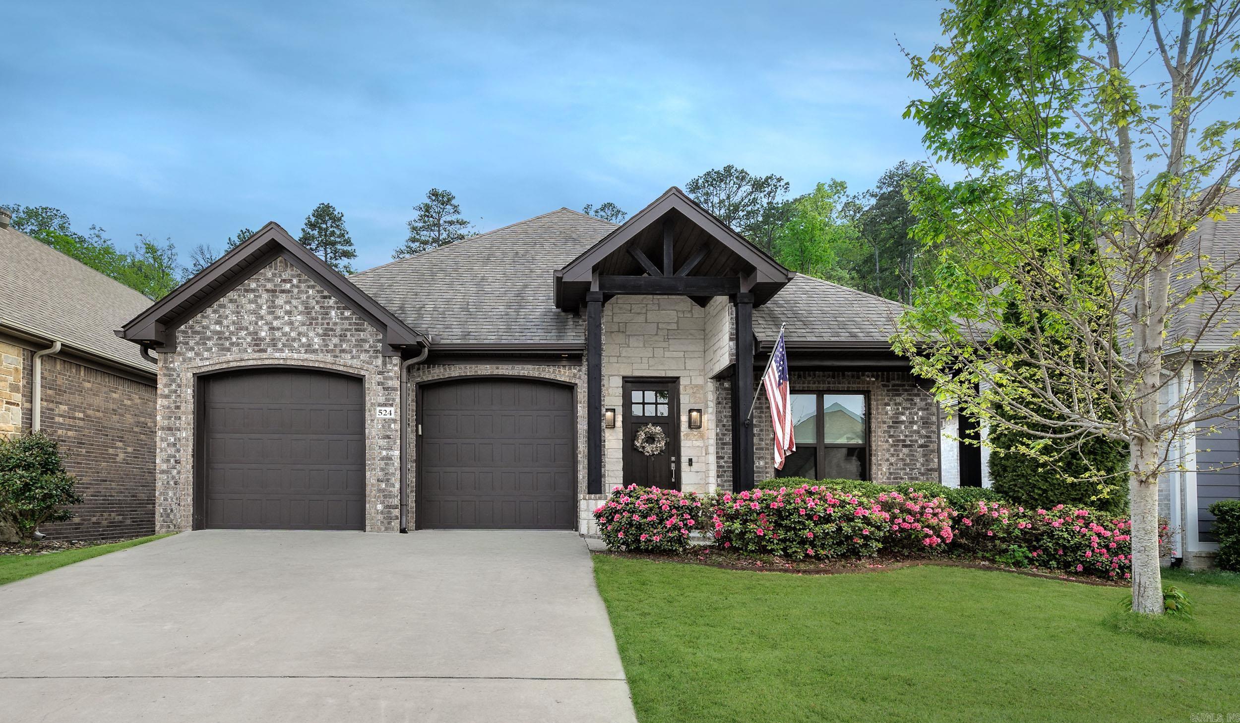 Located in desirable Wildwood Place off Denny Rd in West Little Rock, this well-maintained one-level brick home offers approx. 2016 sq. ft., 3 bedrooms, and 2 full baths. The exterior features attractive rock accents.  Inside, you’ll find beautiful LV floors in the main living areas, an office off the entry, and an open-concept living room with a gas log fireplace, custom built-in bar and cozy dining area. The kitchen includes a breakfast bar, quartz countertops, gas range, microwave, oven, and pantry. Laundry room with sink and storage is conveniently located off the kitchen. The split floor plan provides privacy, with the primary suite featuring a walk-in closet with built-ins, double vanities, soaking tub, and separate shower with a bench. Enjoy the fully fenced backyard with covered porch and fire pit—perfect for relaxing or entertaining. Neighborhood amenities include a pool and playground.