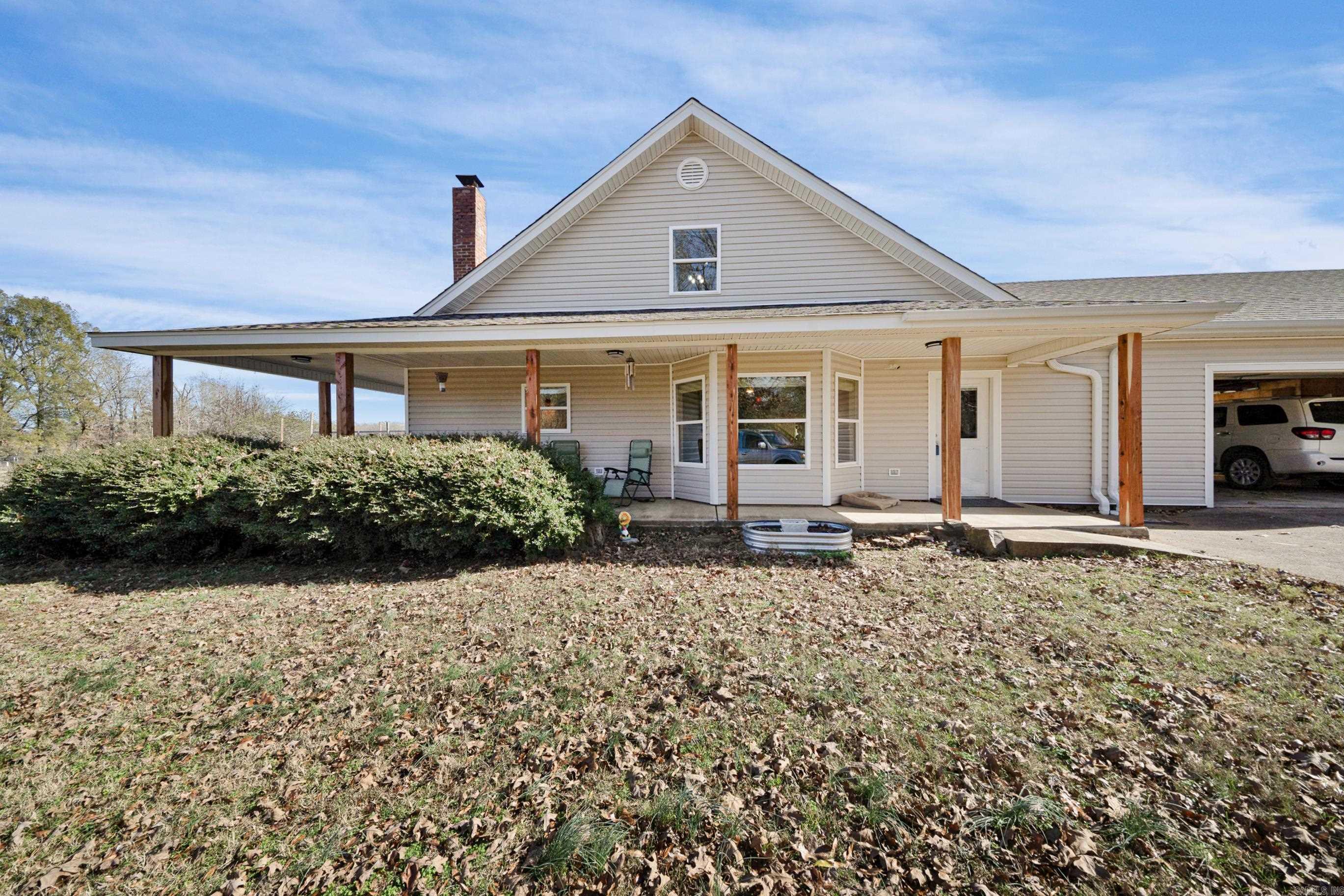 Rustic charm, beautifully updated! 4Bed/4.5Ba home with 6 in walls on 15 acres. New roof, house wrap, siding and windows (2024). Spacious kitchen with working wood stove, an electric stove, beautiful oak cabinets, bar and dining area. Large living room showcases oak built ins with display cases, big brick fireplace with insert and a 19ft vaulted ceiling with 2-tiered custom chandelier. Large bedroom downstairs features built-ins a walk in closet and large bathroom. Insulated 2 car pull through garage with storage opens into a large mudroom with full bathroom, on demand water heater and full kitchen sink with garbage disposal. 1500 sqft insulated shop with 3 roll up doors had metal roof and sides replaced in 2024. 24 ft above ground pool with deck and ramp. Large porch on two sides of the house to watch sunrise/sunset and your animals as well as all the deer and other abundant wildlife. Fenced and cross fenced, barn w/loft, 2 chicken coops, and a nice food plot. Minutes from Vilonia schools, short drive to Cabot or Conway and about 45 minutes to Little Rock. Agents see remarks