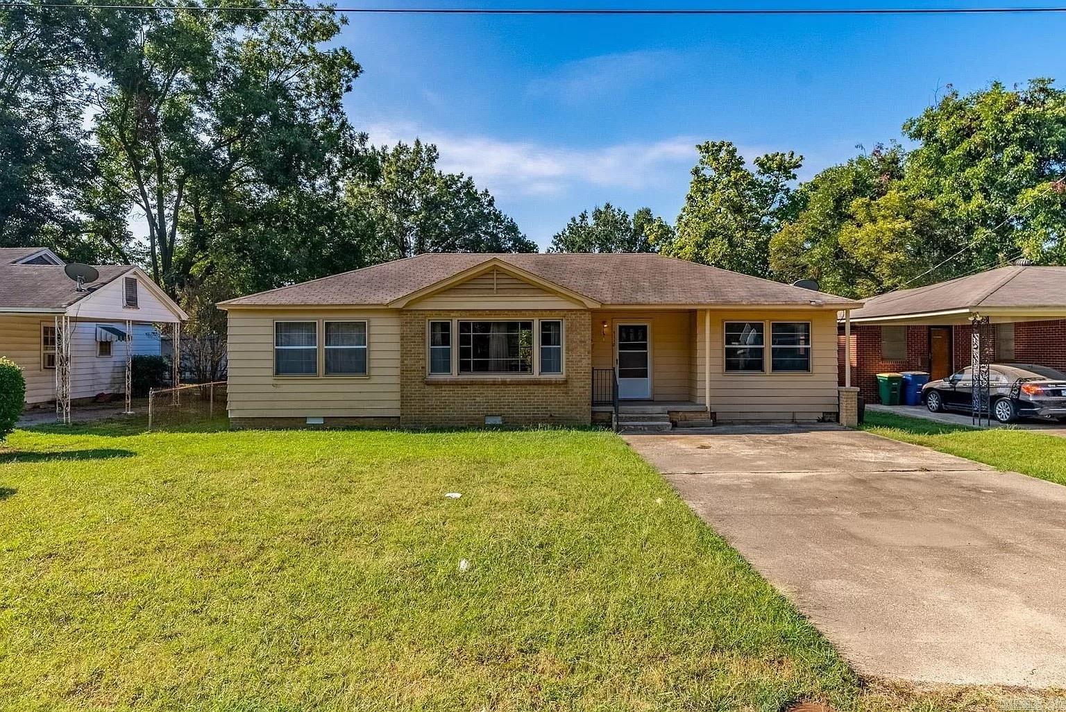 Welcome to 5118 Lynch Drive in North Little Rock — a spacious one-story home offering classic charm and room to spread out.  Great Investment property!  Built in 1951, this 3-bedroom, 2-bath home features approximately 1,222 square feet of living space, all on one level. Hardwood floors add warmth throughout much of the home, while central heat and air provide year-round comfort. The layout includes a great room and a kitchen/dining combo that creates an easy flow for everyday living.  Situated on approximately 0.26 acres, the property offers a generously sized, fully fenced backyard with plenty of room to enjoy the outdoors. Multiple patio areas provide space for relaxing or entertaining, and the extended driveway with parking pads adds convenience.  With its combination of usable indoor space and a large yard, this home offers flexibility and opportunity in an established subdivision. Schedule your showing and come see the potential for yourself.