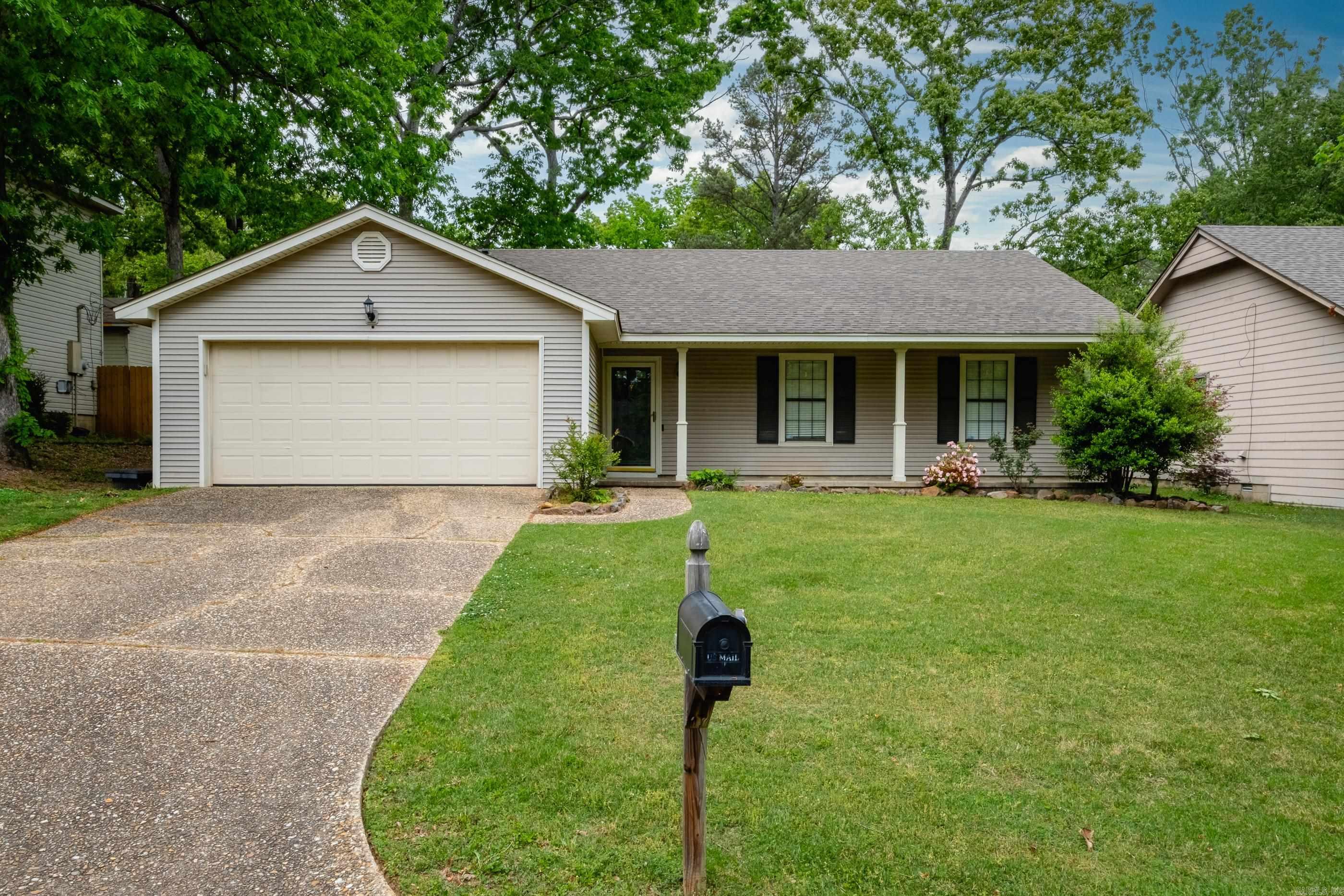 Charming one-story home in the heart of West Little Rock with great curb appeal. Conveniently located near shopping, restaurants, and easy interstate access, this home offers both comfort and convenience. The inviting living room features a vaulted ceiling and a cozy fireplace with gas logs, creating a warm and spacious gathering area. The kitchen includes granite countertops and a pantry for extra storage and a refrigerator that conveys. A large laundry room adds everyday practicality. Washer and dryer also convey. Enjoy relaxing on the full front porch and take advantage of the rear patio and fully fenced backyard—perfect for pets, play, or entertaining. Agents, see remarks.