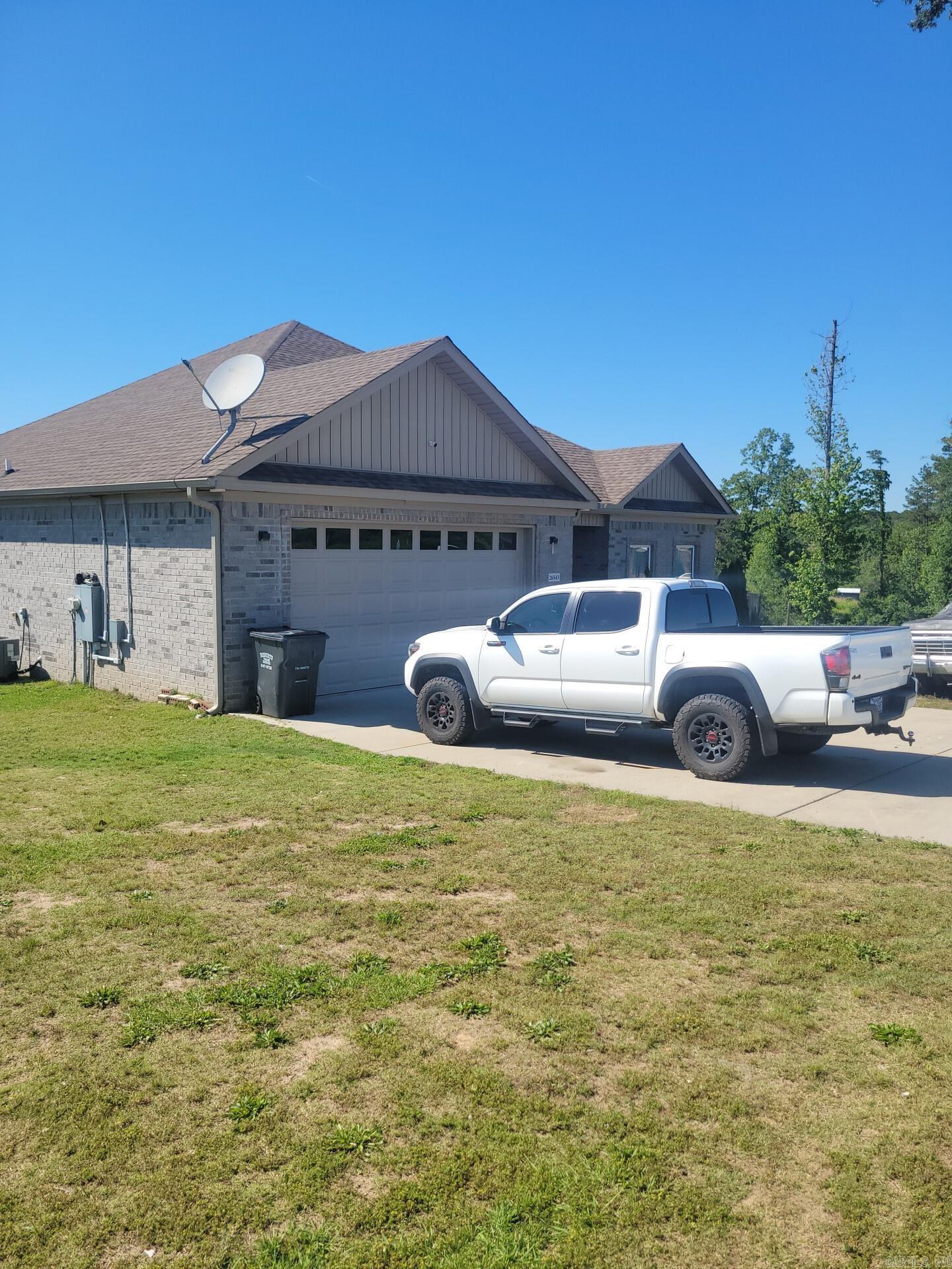 This stunning single-family home located at 26543 S Sardis Rd in Bauxite, AR was built in 2021 and offers modern amenities and stylish finishes throughout. With 2 bathrooms and a spacious 2,215 sq.ft. of finished living space, this property is perfect for a growing family or those who love to entertain. Situated on a sprawling 3-acre lot, there is plenty of room to enjoy the outdoors and take in the peaceful surroundings. Don't miss out on the opportunity to make this beautiful new construction home your own!.