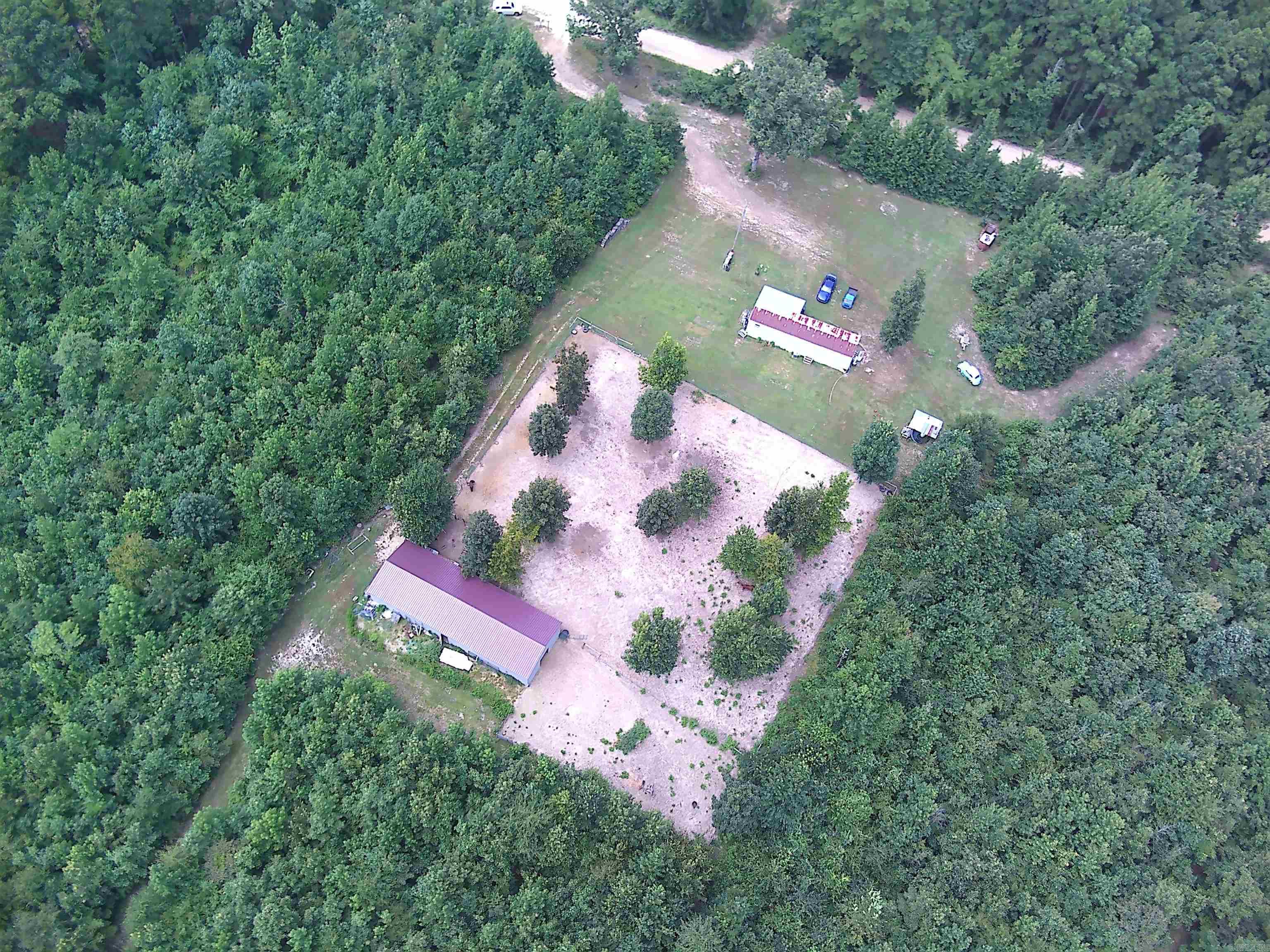 ***Beautiful 7.78 Acre Property with New 24x70 Shop Building on Scenic Skyline Drive*** Multiple locations to build a new home, cabin or hunting retreat while living in the mobile home. The interior of the mobile home has been updated and is super cute and cozy with a spacious kitchen and living area. For hunters, there is a covered area with water and electricity for cleaning game as well as "shooting lanes" and multiple places for deer stands. The new 24x70 metal building has overhead doors on each side for pull through convenience and to store all of your toys and equipment. High speed fiber internet by South Central Co-op lets you stay connected while also enjoying the country life!30 minutes from Hot Springs, Arkadelphia and I30. 15 minutes to DeGray Lake.