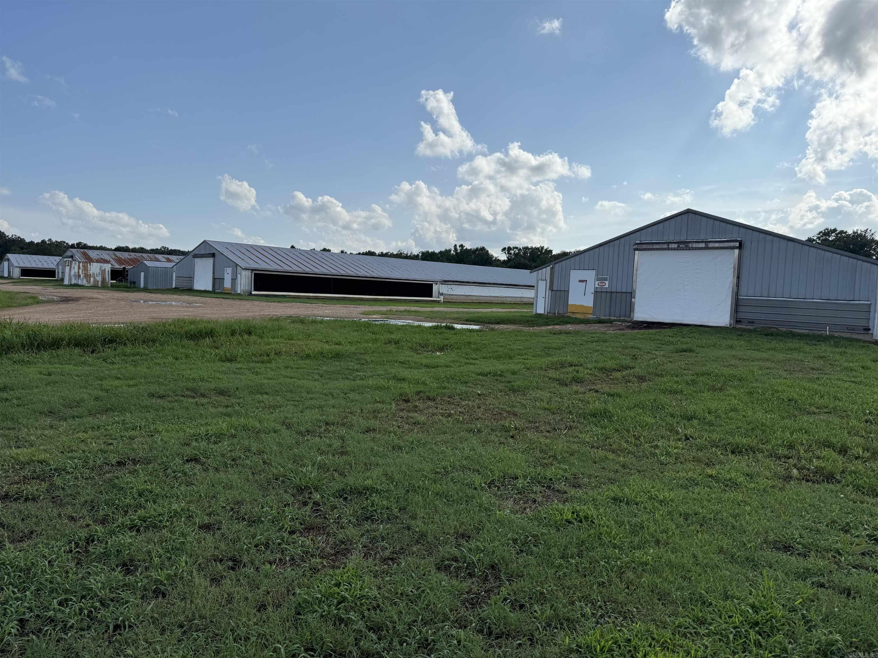Poultry operation in Hempstead County offers 10 house broiler farm on approx. 45 acres. Current Tyson Contract, two generators, two incinerators, extra fans, three wells, emergency rural water available, extra cool cells, poultry houses were totally updated in 2019. Some farm equipment and supplies can convey to new owner.  Property also offers a 3 bed/2 bath mobile home. Contact our office for more details.