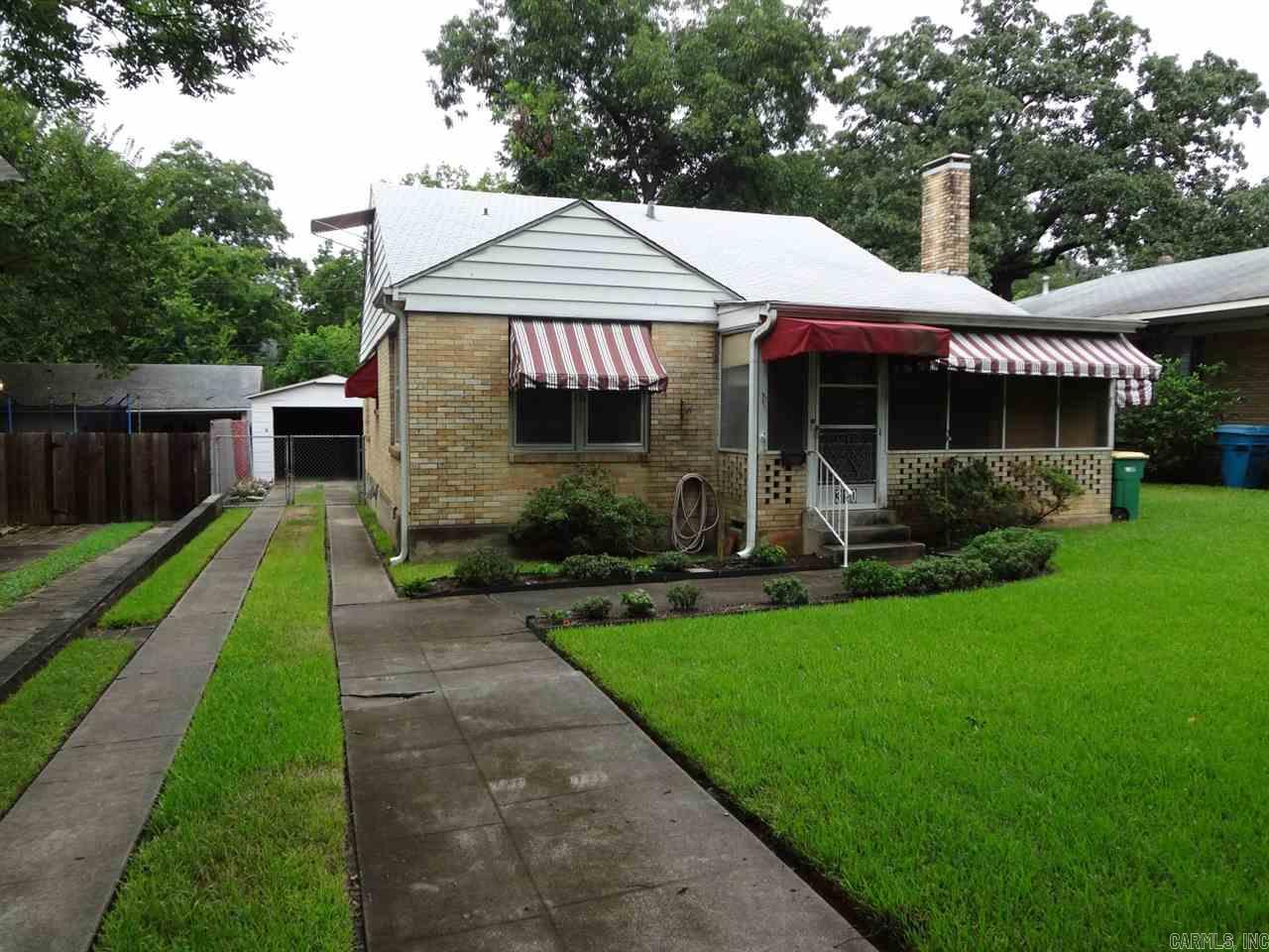 ***Property is in a trust, no seller disclosure, no repairs. Offer subject to court & trust company. Special warranty deed.***  All brick 2 bedroom home. Brick bungalow. Hardwoods refinished. Huge attic. Potential for expansions. Detached Garage. Fenced yard.