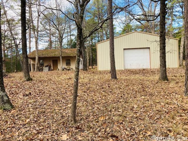 HUNTING CABIN WITH LAND IN THE NATIONAL FORREST This hunting cabin with 2 acres is in the National Forrest, located in Calico Rock, Arkansas. If you are looking for a quiet place to get away from it all and do a little hunting, this could be it! The one room cabin is 720 feet, with a 900 square foot shop. Both the cabin and shop have electricity connected. The shop has a concrete floor, with a roll up door, and a walk through door.  The property is approximately 4 miles from the White River boat ramp, just a short distance from the county road.  Walk out the back door and into the National Forrest! Price reduced to $77,900