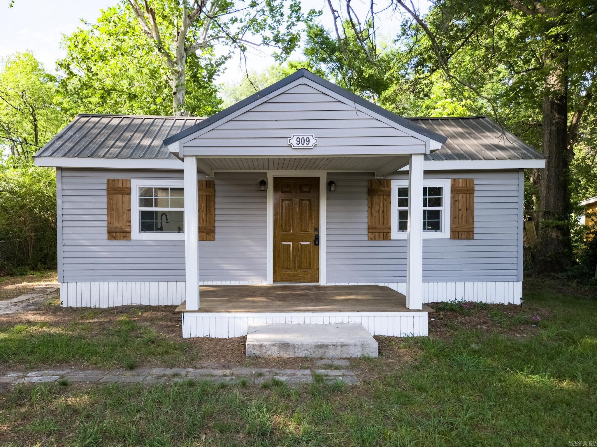 Perfect starter home in a low traffic quiet neighborhood. This fully remodeled home features two bedrooms, both with walk in closets and two full bathrooms. Find custom tile shower in the master ensuite bathroom, custom soft close wood cabinets and pot filler over the range area are added bonuses. Newly installed luxury vinyl plank flooring throughout and freshly stained front porch make maintaining your floor surfaces a breeze. High efficiency windows, mini split heat and air units and new attic insulation will help you keep your energy bills low year round in this all electric home. Long lasting metal roof and beautiful vinyl siding make your exterior elegant and low maintenance. Property also comes with a 10x12 (measurements approximate) storage building with new windows and city approval to build a mother in law suite in the back yard with access to the alley. Schedule your showing today before it's gone!