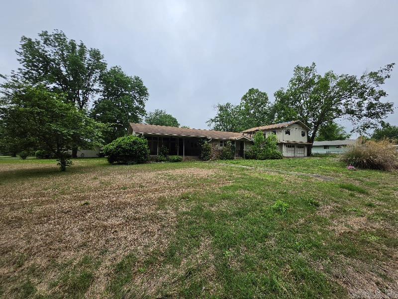 So much room and so much potential! You will be hard pressed to find this much square footage at this price - and it's a blank canvas for you to completely renovate! Large yard on a corner lot that is almost an acre. Located near Cox Lake, this property has potential to also be a vacation rental property. Lots of windows, sunken den with bar area, oversized garage and garage apartment. Privacy fenced back yard - you have to see this one!  Agents see remarks.