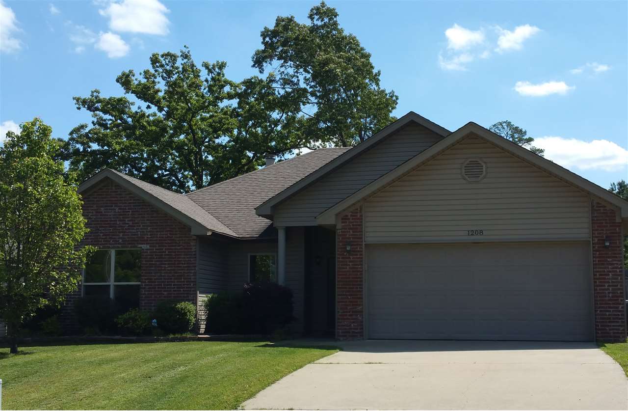 Large windows and built-in bookshelves surrounding the fireplace will capture your attention when you first walk into this beautiful home. It has great landscaping in the front yard, wonderful hardwood floors throughout, fresh paint in the master bedroom, and nice carpet in the bedrooms. Fully fenced backyard with a fire pit on the patio. Split floor plan! Master Bedroom has an spacious en-suite bath with walk-in closets. A short drive to Tyndall Park and just minutes from I-30. *New Roof just installed*