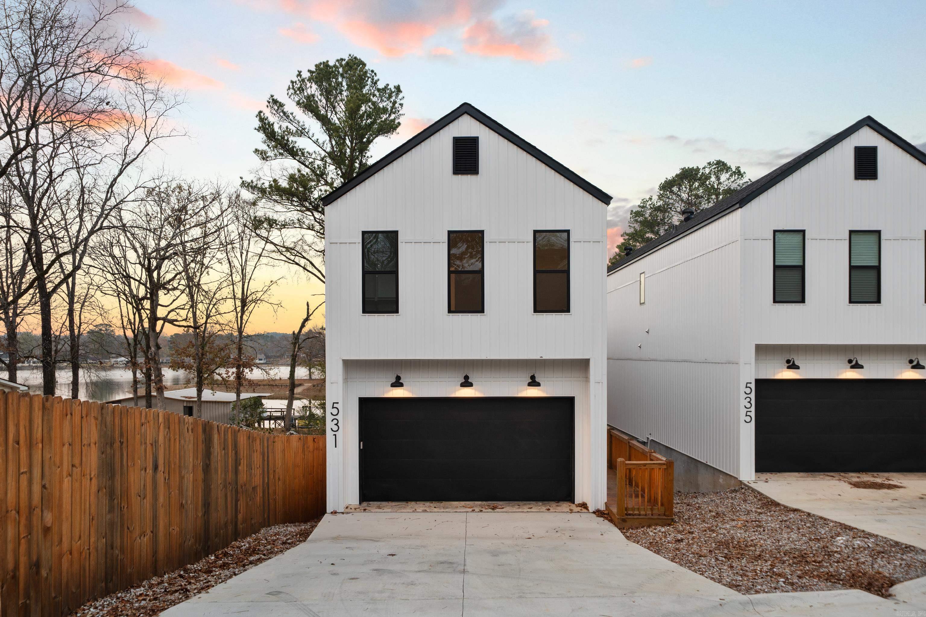 **Stunning Lakefront Retreat at 531 North Shore Dr, Hot Springs, AR 71913** Welcome to your dream getaway on the picturesque shores of Lake Hamilton! This exquisite property offers an unparalleled blend of serenity and luxury, perfect for both relaxation and entertainment. Enjoy panoramic views of Lake Hamilton from nearly every room in the house, creating a tranquil atmosphere that invites you to unwind. The open-concept design features a generous living room with large windows, allowing natural light to flood the space while showcasing the stunning lake scenery. The fully-equipped kitchen boasts stainless steel appliances, quartz countertops, and ample storage, making it a chef's delight for preparing meals and entertaining guests. This home includes multiple well-appointed bedrooms, each designed for comfort, and beautiful views, ensuring restful nights. Step outside to your private deck, ideal for summer barbeques, morning coffee, or simply soaking up the sun. A well-maintained lawn leads directly to the lake, perfect for swimming, fishing, or boating. Ample parking space, ideal for both year-round living and seasonal rentals. NO STR RESTRICTIONS.