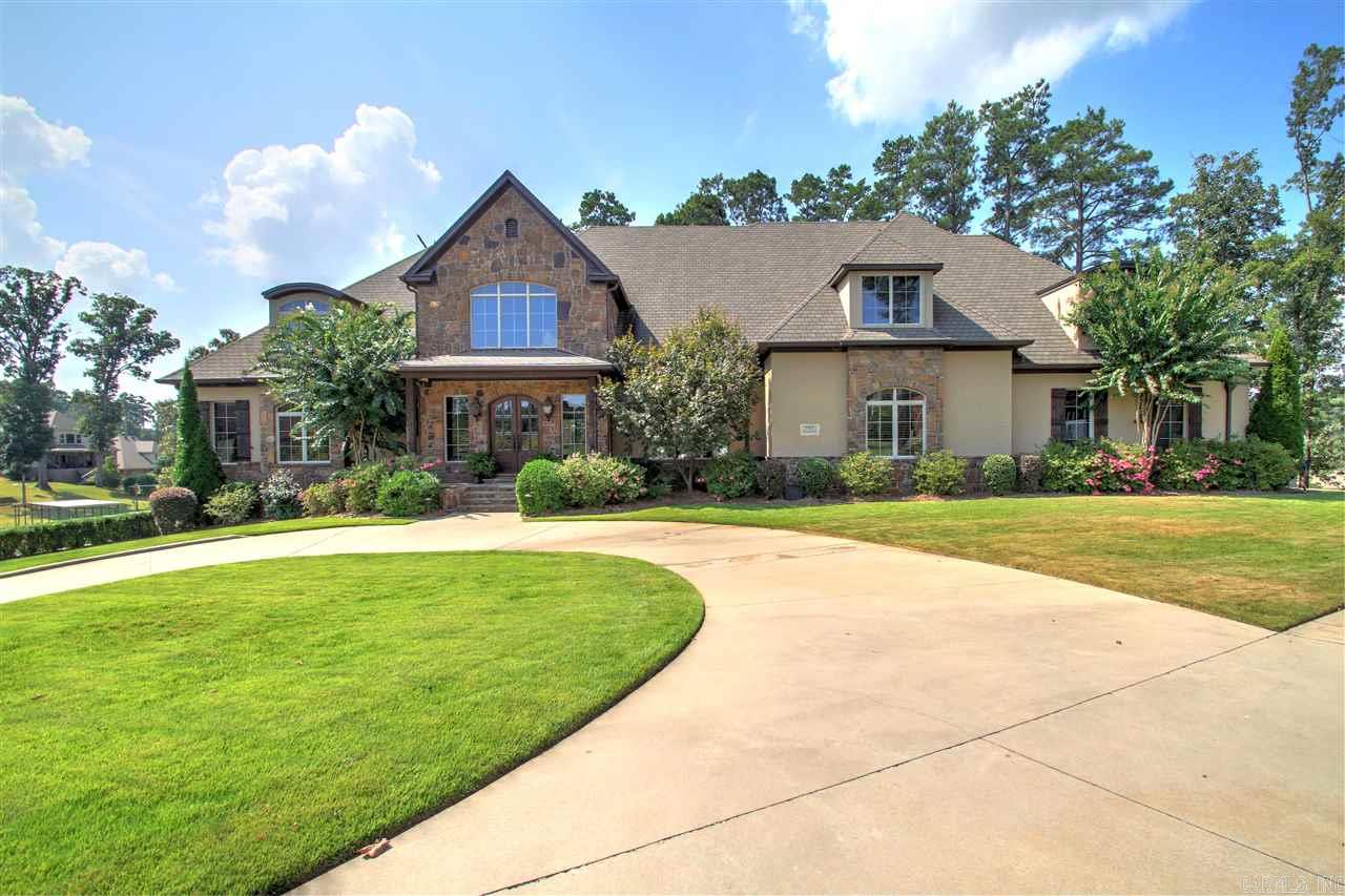 A custom built home behind a gate on Hurricane Lake. Sits on a 1.37 acre point on the lake with breath taking views. This home has everything and more you could desire.  With a whole home generator you will always have the comfort of your geo thermal heat and air unit. Other amenities include: heated salt water pool, hot tub, outdoor kitchen, subzero fridge&freezer, central vac, 2 laundry rooms, flag stone porches, cedar basement, 3 fire places, wolf 8 burner stove, and many more extras too many to list