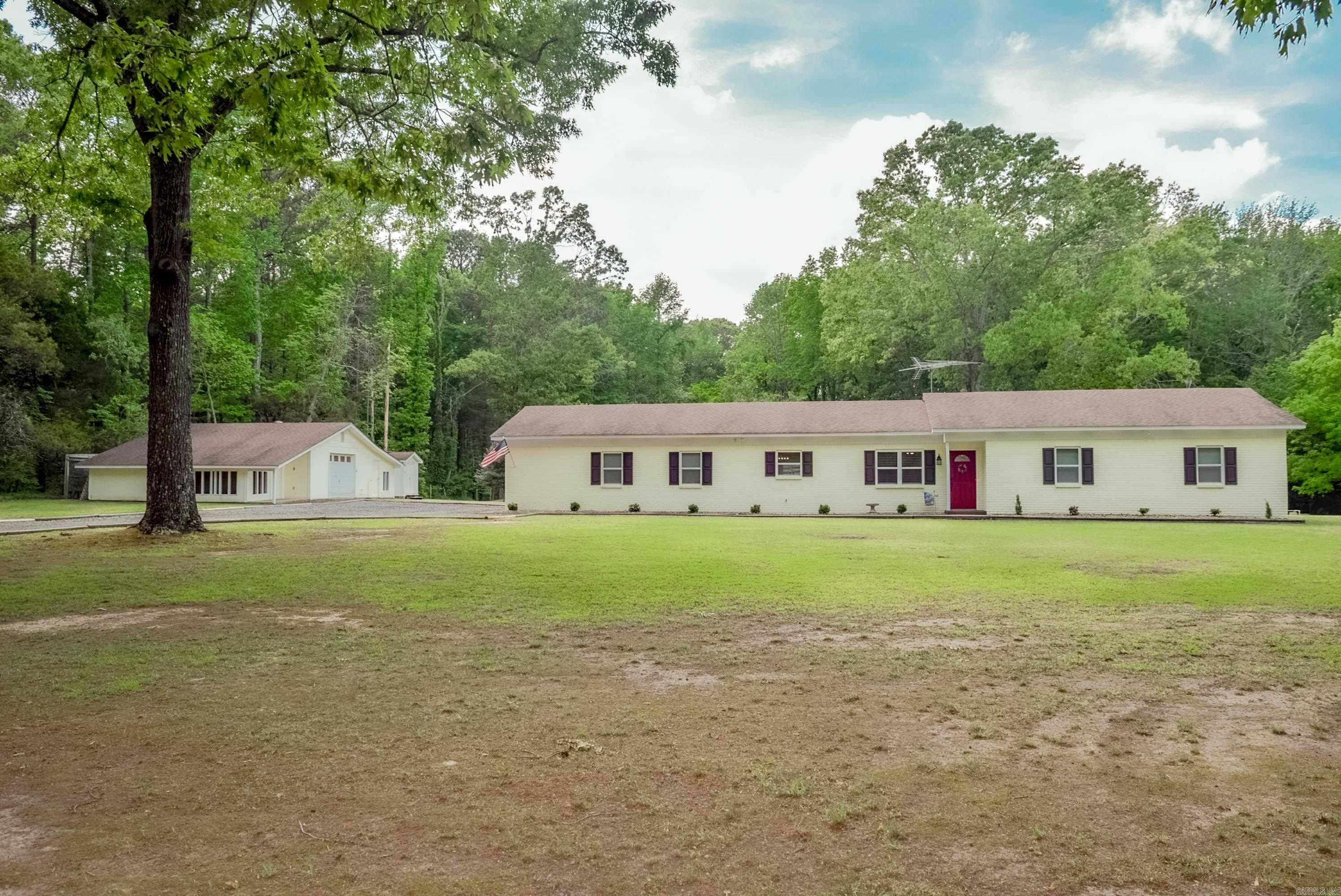 Country living at its finest—just minutes from Cabot city limits! This beautiful 3.75 acre property offers the perfect blend of peaceful surroundings and everyday convenience. The home features an updated kitchen with stunning cabinetry, double oven and a stylish backsplash. Dishwasher and microwave is less then a year old. Along with updated windows throughout that bring in plenty of natural light.  Enjoy the bonus sunroom located just off the kitchen and dining area, providing easy access to the patio—ideal for entertaining guests or enjoying a quiet evening outdoors. The partially fenced backyard offers plenty of space for animals, gardening, or simply soaking in the wide-open space. Vinyl fencing along with chain-link fence. A 20x28 shop adds extra functionality, making this property as practical as it is charming. Make note that the attached garage is heated and cooled.