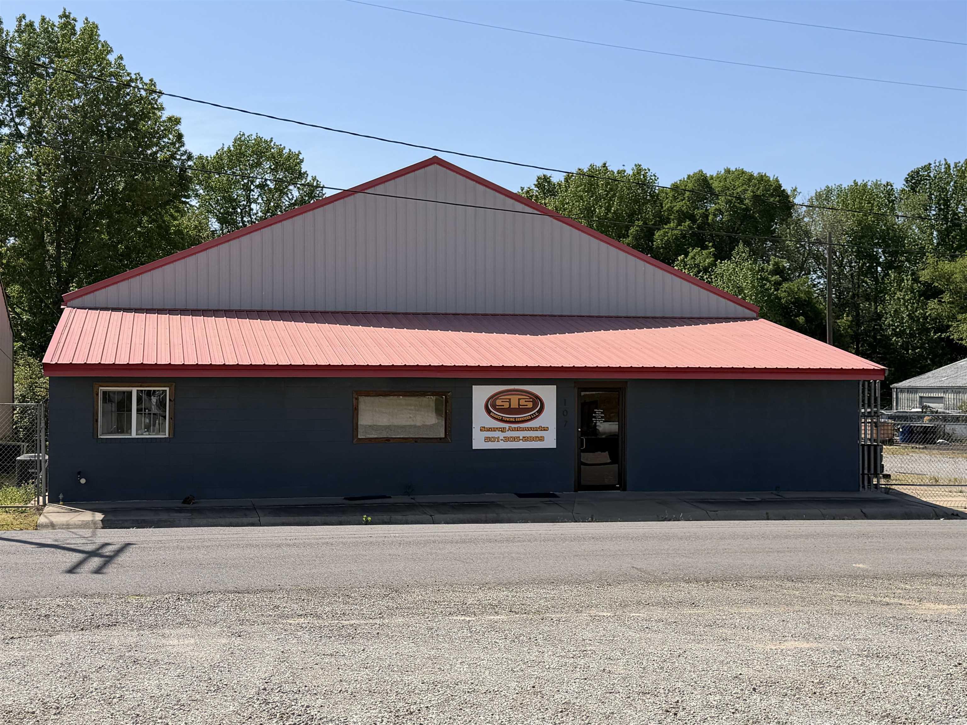 Prime Commercial Property - Was presently Auto Mechanic Shop and Tow Truck Business for over 30 years. Seller has retired. Located on a well-traveled road with easy access for customers and large vehicles alike, this property is ready to support your operation from day one. Spacious one acre fenced lot with ample room for vehicle storage, tow trucks and customer parking. Large garage bays with high ceilings, standard car lift and heavy duty lift which lifts 10,000 lbs, oil burner heater, service pit for 18 wheelers, frame machine and much more. Office space for customer reception and dispatch. Excellent location with strong daily traffic counts. Diagnostic equipment and AC machine negotiable. All blown in insulation, metal air lines. Convenient access to interstate and airport. Don't miss this chance to secure a versatile commercial space in a growing area. Schedule a showing today and put your business in the driver's seat of success. SEE AGENT REMARKS!