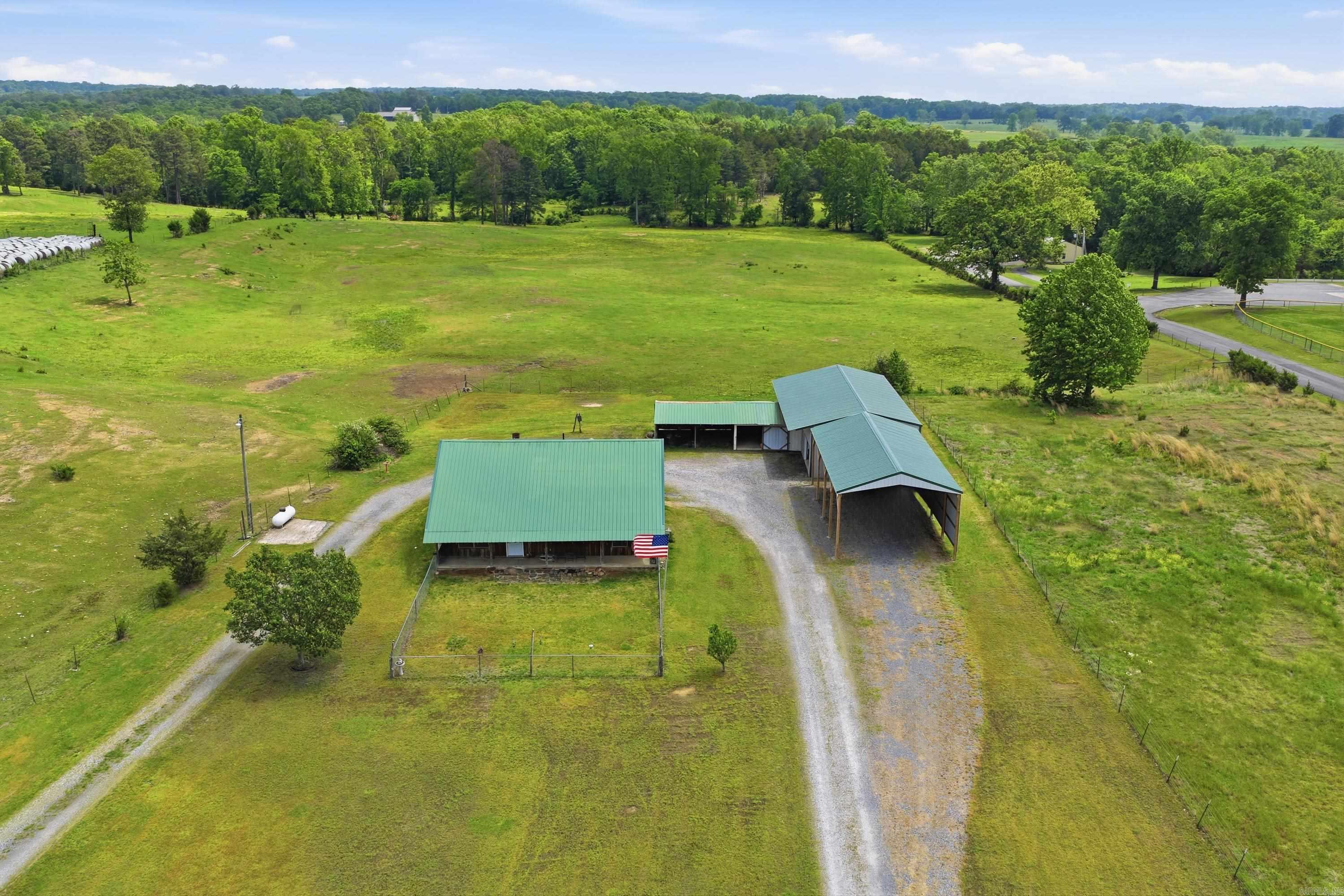 Live where the music plays! This 1,486 sq ft, 3-bedroom, 3-bath home sits on 1.2 beautiful acres right next to the city park—home to summer concerts, playgrounds, and year-round community fun. NEW CENTRAL H/A JUST ADDED 11-17-2025 Kitchen appliances, washer, & dryer stay.  Bring all your toys—there’s a 25x50 shop with 2 Overhead Garage Doors , plus a massive 23x45 covered carport with 15ft. Clearance & 50-amp service for your RV, boat, or extra vehicles. Inside, you’ll find a comfortable layout with Main Floor having guest bedroom & hallway Guest Bathroom, as well as Primary Bedroom having walk-in shower & Soaking Tub (both recently remodeled). Upstairs has another Large Bedroom (could be used as a Secondary Primary Bedroom) including Large walk-in Tiled shower with walk in closet.  Outside space to garden, play, or just relax under the stars. Whether you’re looking for a vacation retreat, full-time home, or investment property, this one checks every box. (Survey has not been done yet on property, so Tax Assessor drawing of land is not correct).  View Virtual Tour Video Below in details.  By appointment only.