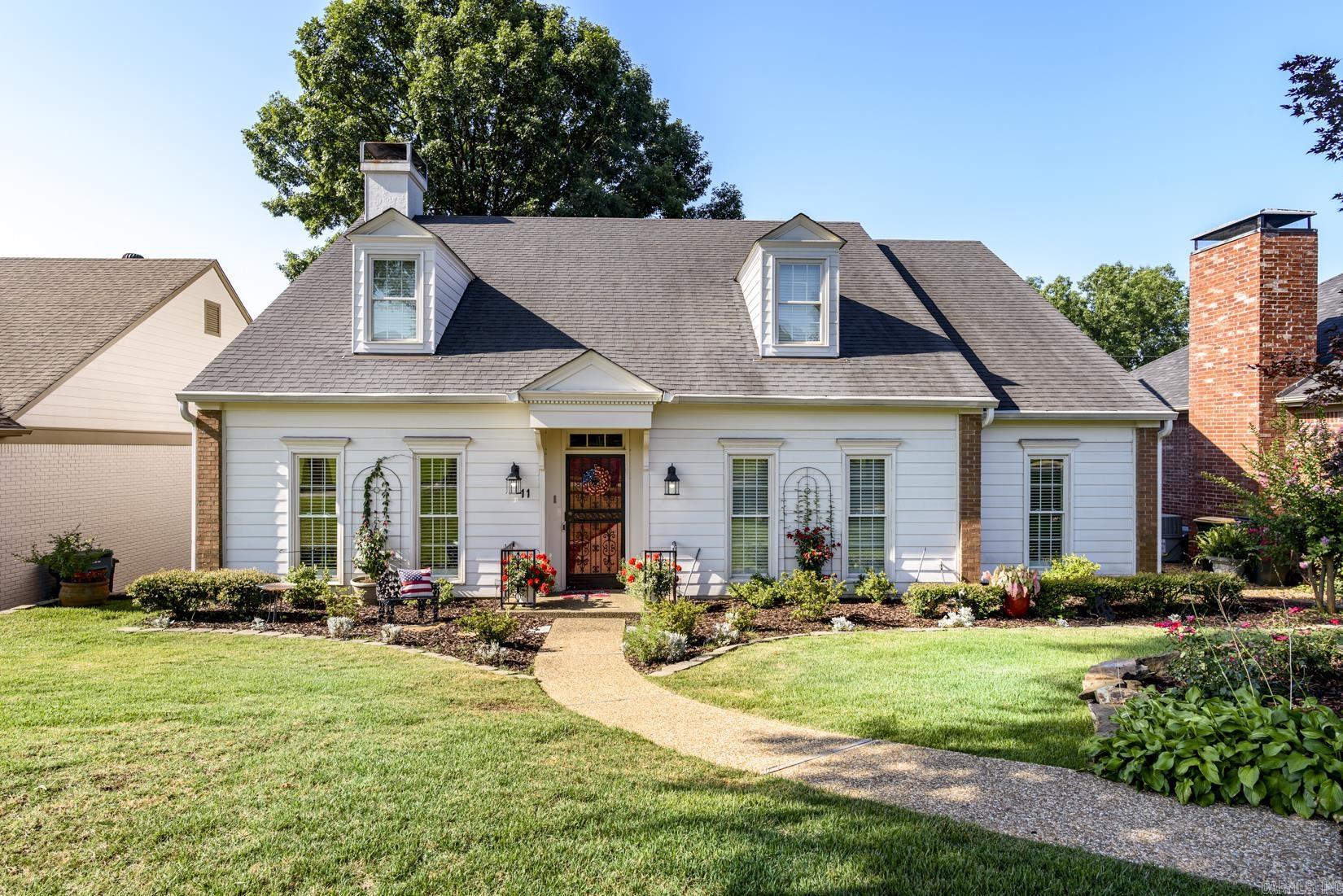 Charming one-level patio home on a quiet cul-de-sac in the heart of West Little Rock! Alley access leads to the attached two-car garage, while professionally landscaped front and rear courtyards provide beautiful outdoor living spaces. A tiled foyer welcomes you into the spacious great room featuring a fireplace and new hardwood floors. The formal dining room overlooks the private courtyard, creating the perfect setting for entertaining. The large kitchen offers slab granite countertops, tile floors, a center island, abundant cabinetry, and a sunny breakfast area with views of the covered porch and deck. Two guest bedrooms share convenient access to a full bath. The oversized primary suite features new hardwood floors and a private ensuite bath. This thoughtfully designed home combines spacious one-level living, quality updates, and an outstanding location close to shopping, dining, and everything West Little Rock has to offer.