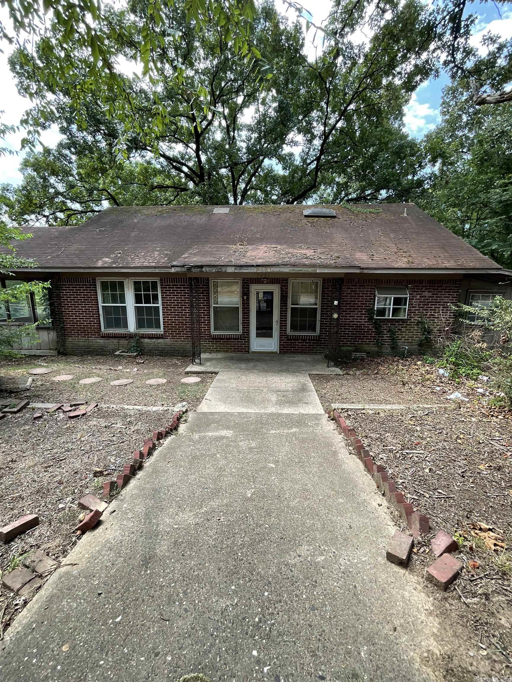 AS-IS, WHERE-IS. This home is a great investment opportunity. Lots of room to remodel. This home features a large kitchen, two living areas, two decks, and a large yard with extra storage buildings.