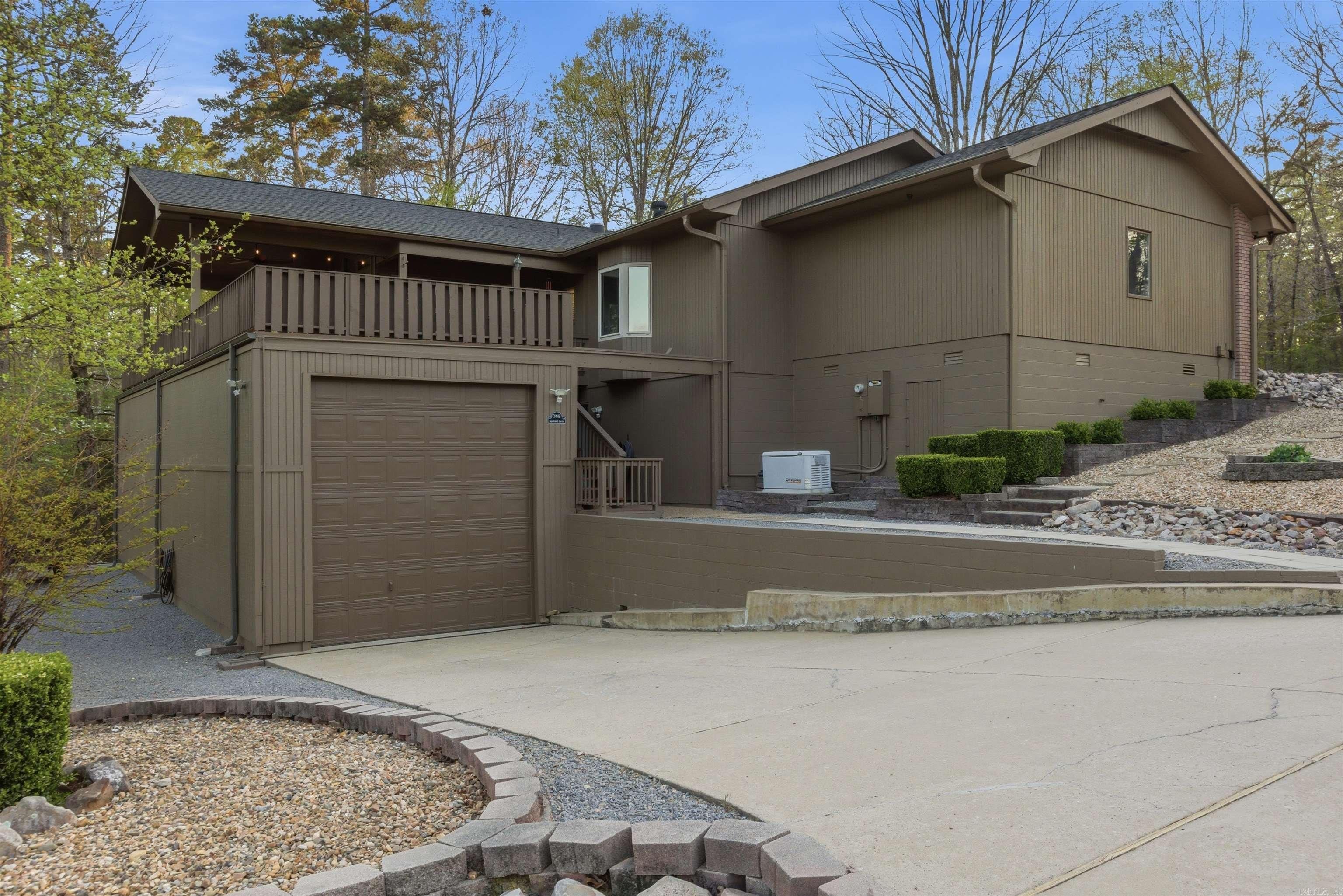 Tucked just moments from Lake Balboa, this beautifully updated home blends comfort, efficiency, and standout features you won’t find every day. Designed with versatility in mind, the property includes a spacious RV or motorhome Garage (once home to a 40' Monaco Bus) and shop—perfect for hobbies, storage, or all your lake-life gear. Inside, you’ll find a fresh, bright modern feel with the entire interior recently repainted, no popcorn ceilings, and no carpet! Gorgeous engineered hardwood flooring for a clean, upscale look. Newer appliances, can lighting and solar tubes! The thoughtfully designed layout includes mini-split systems in both the office and shop, offering personalized climate control wherever you need it. Major upgrades bring peace of mind, including a whole-house generator connected to a buried propane tank, ensuring you’re always prepared. The crawlspace has been professionally encapsulated for added efficiency and long-term durability. One of the true highlights? A rooftop deck—perfect for relaxing, entertaining, or taking in the surroundings. This is a rare opportunity to own a move-in-ready home with premium features in a prime lake-area location.