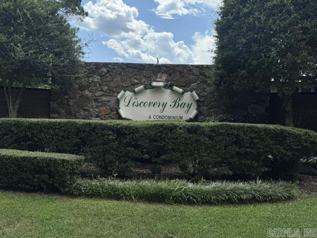 The entire Discovery Bay Complex has a brand-new (June 26) metal roof, new awnings, and the boat dock has a brand-new roof.  Spend many relaxing hours at this lovely 2-bedroom, 1.5-bath lakefront condo. It is located in the heart of Lake Hamilton. Discovery Bay is conveniently located minutes from Oaklawn Racing Casino Resort, downtown Hot Springs, restaurants, and family-friendly entertainment venues. The lovely setting, with its updated swimming pool, is the heartbeat of the condo.  This property is perfect for lake lovers and outdoor enthusiasts.  The lake is a few steps from the patio, and the covered boat dock is a few feet away from the condo. A special bonus is that a newly fenced-in vacant lot across the street is available for storing boat trailers. A boat ramp available for Discovery Bay, next to the property. Show with Sentrikey. No nightly rentals.