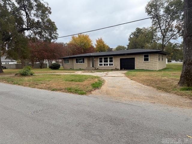 Completely updated 4 bedroom, 2 bath home sitting on 3 corner lots. 2,103 sq.ft. Brick home with new windows, roof, HVAC, kitchen stove and updated bathrooms. Updated wiring and panel box. Dining room has beautiful original hardwood floors. This home is move-in ready for your family. Only 4 blocks from the elementary school. The family room has a great open floor plan connected to the dining room.