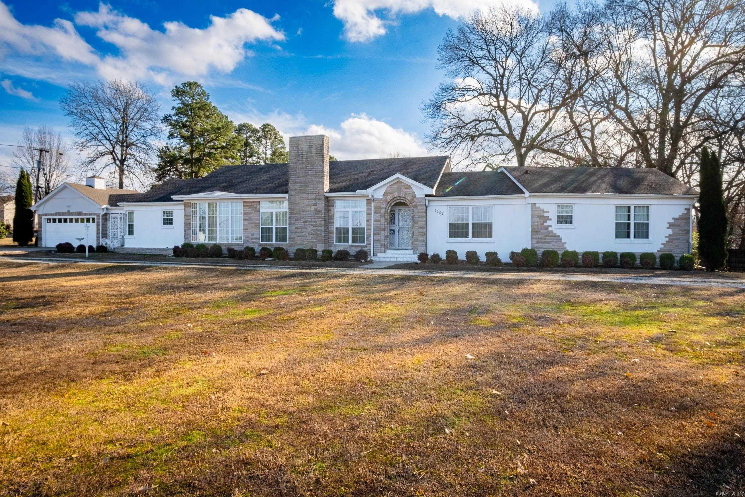 Don't miss this incredible opportunity to own a home that is local to everything, but still offers you plenty of space to stretch out! Located in the city of Malvern and only 20 minutes to Hot Springs, race tracks, shopping and dining galore!   This home was the talk of the town when originally built and the current owners have taken great care of this home over the years! This property is nestled on 1.37 acres with a shop and a fenced in backyard.   The layout of this home provides plenty of space to host guests, in addition to a full-size sunroom that stays cozy in any weather! The formal living room and the sitting room can be connected for more space or separated for privacy with a sliding partition!   The home is heated by and cooled with central HVAC, but has additional gas heaters just in case you get any bad winter weather! There's also a reinforced safe room that could be used as a tornado shelter or storage room! Home speakers fill the house for your entertainment in addition to other amenities! The kitchen offers plenty of space and connects to a formal dining room for serving guests! The shop is a great addition with a connected lean-to for any storage needs!