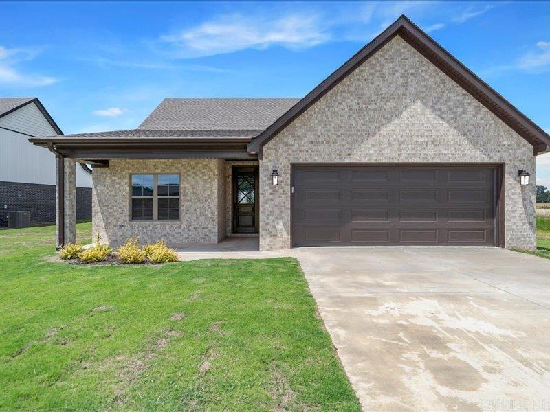 This brand new three-bedroom, two-bath home in Manila, Arkansas, offers a perfect blend of modern design and rustic charm. As you enter, you're greeted by an expansive open concept living area where a striking large beam adds warmth and character to the space. The beam creates an eye-catching focal point in the main living space, giving the home a welcoming, open feel that is perfect for both family gatherings and relaxing evenings.    The sleek, contemporary kitchen features high-end appliances, plenty of cabinet storage, and a stylish island that offers additional counter space for cooking and entertaining. The seamless flow from the kitchen into the dining and living areas ensures that every part of the home feels connected and spacious.    The master bedroom is a serene retreat, complete with an en-suite bathroom featuring modern fixtures and a beautifully designed shower. The two additional bedrooms are generously sized and offer flexibility for various uses, such as guest rooms, home offices, or children's rooms.    Outside, the home sits on a sizable lot, giving you plenty of space to enjoy the outdoors.
