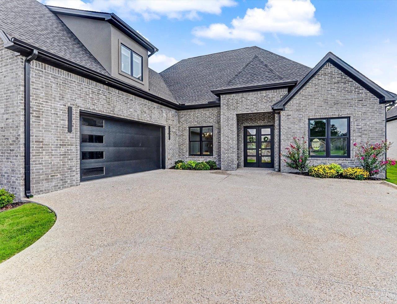 Move-in ready 4BR/3BA home in the gated Arlington Park community near Hot Springs Country Club. Home features an open floor plan with high ceilings, quartz countertops, gas cooktop, double wall ovens, and no carpet throughout.   The spacious primary suite includes a large walk-in closet with custom organization, double vanities, granite countertops, heated fog-free mirrors, and a walk-in shower. Built-in shelving, a mudroom with storage, and a large laundry room with utility sink, hanging space, and extra cabinetry provide exceptional storage throughout. Upstairs bonus room offers flexible space for a media room, game room, or office.   Enjoy the covered patio with fireplace overlooking a private backyard. Tankless water heater, separate upstairs HVAC system, and oversized garage with golf cart space and storage. Golf cart access to Hot Springs Country Club. Conveniently located near Lake Hamilton, Oaklawn, downtown Hot Springs, shopping, dining, medical facilities, and Hot Springs National Park. Quiet setting in a desirable school district.