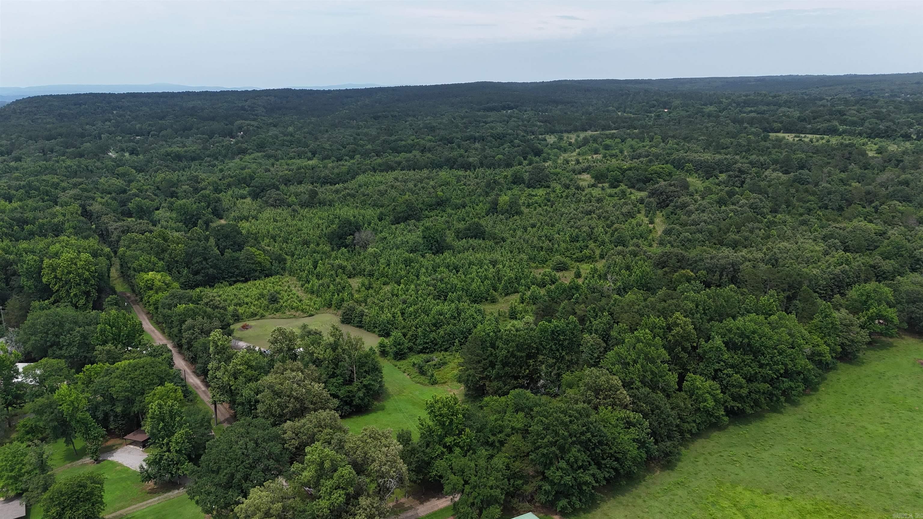 ract 1, 5+/- Acres Build Sites Near Shoal Bay Park  Midwest Land Group is pleased to present Tract 1of 24 individual building sites located adjacent to Shoal Bay Park in New Blaine, Arkansas. These tracts, which will be surveyed into approximately 5+/- acre parcels, offer level sites that require minimal preparation for construction. Centrally located between Paris and Dardenelle. The interior tracts will be accessible via a planned road, and city water service is slated for installation.  These parcels are designed to meet a variety of needs, providing an excellent opportunity for anyone looking to build in this desirable area. The property is ideally located just moments from Shoal Bay Park, which provides boat ramps, swimming spots, and campsites. Residents can enjoy access to more than 50 miles of the Arkansas River and Lake Dardanelle. Furthermore, the Ozark-St. Francis National Forest is roughly 3 miles away, offering a wealth of recreational activities including hiking, horseback riding, camping, hunting, and extensive trails for SXS vehicles.