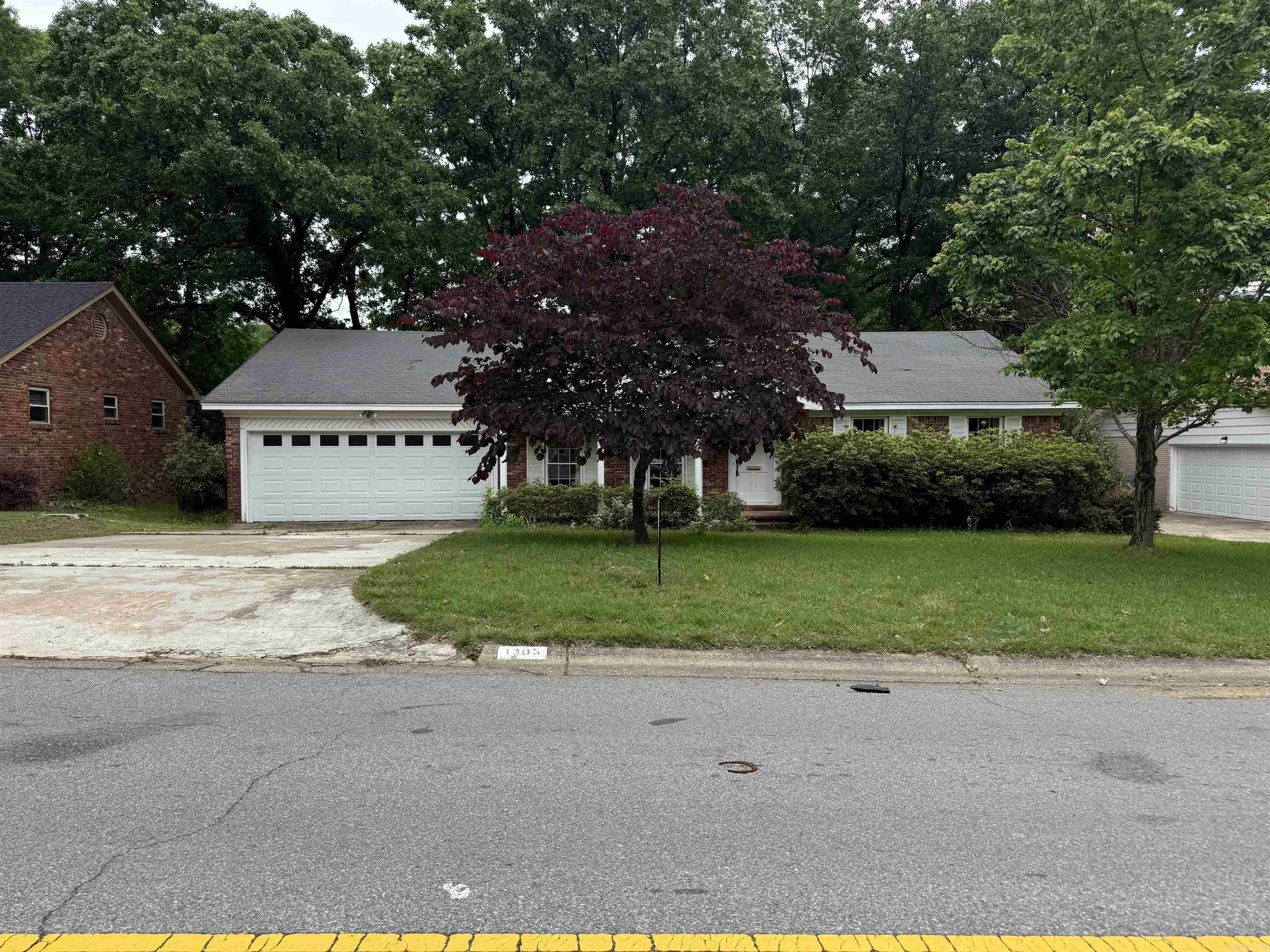 Investors dream or a little sweat equity.  This is your chance.  4 bedroom, 2 and a half baths.  Formal Den/Dining combo, eat in kitchen, Den has French doors leading out to a large wood deck.  Den has a brick gas fireplace. Original hardwood floors throughout most of the home! Call me for your tour today.