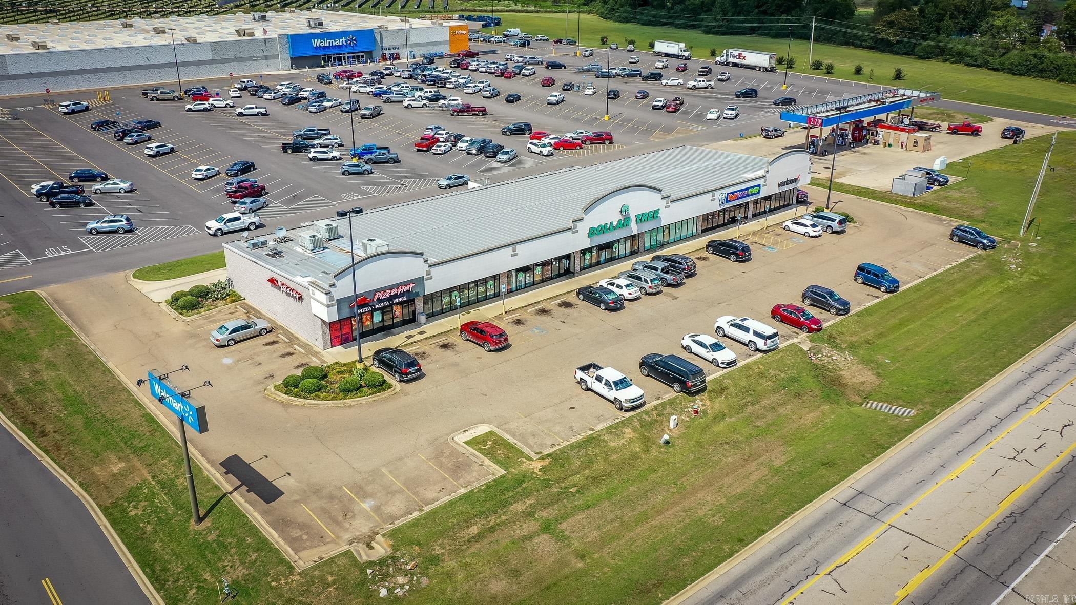Positioned directly in front of Walmart Supercenter, this fully leased retail center in Nashville, Arkansas, delivers instant credibility, high traffic exposure, and consistent cash flow. Anchored by national and regional tenants with proven performance, this property is a turn-key investment opportunity in the heart of Howard County’s thriving retail corridor.  • 100% Occupied – Four strong, nationally recognized tenants  • Proven NOI Stability – $468K in forecasted lease income over the next three years  • Prime Location – Direct Walmart exposure with cross-shopping synergy and top traffic counts  • Future Upside – Multiple renewal options in place and potential rent escalations  • Low Management Demand – Long-term tenants with established operational history  This is a rare chance to own one of Nashville’s most visible and income-producing retail centers—perfect for investors seeking stable returns with growth potential in a strong small-market economy.