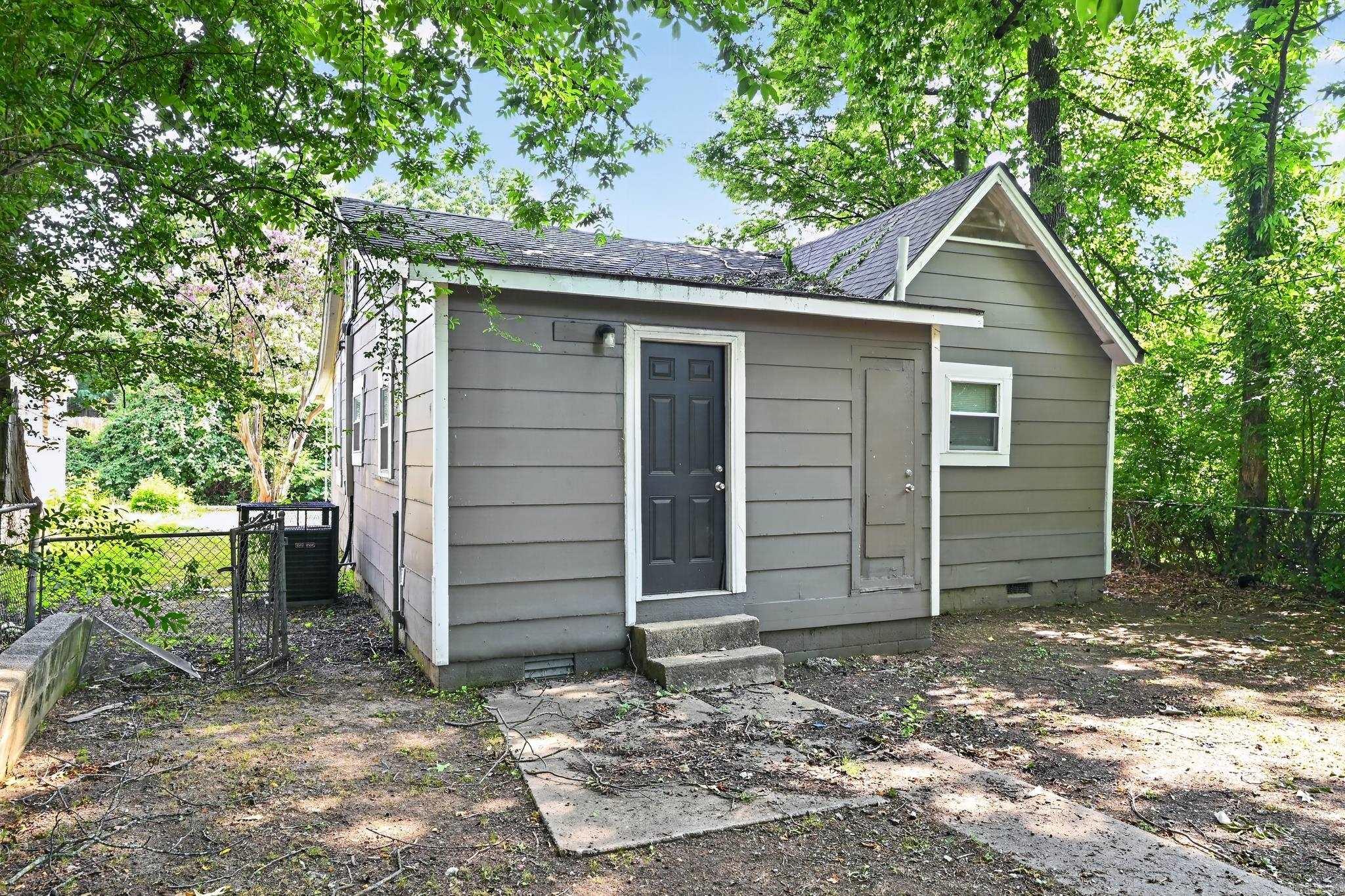 Character and convenience meet in this 2-bedroom, 1-bathroom traditional home located in the established Boulevard Terrace community. Spanning 1,036 square feet, the interior features classic hardwood and new flooring throughout, a cozy fireplace, and an eat-in kitchen designed for functional living. The property sits on a level 0.14-acre lot with a private patio, offering a manageable outdoor space for relaxation or entertainment. This residence is exceptionally well-placed for students and professionals, situated just down the street from the University of Arkansas at Little Rock (UALR).
