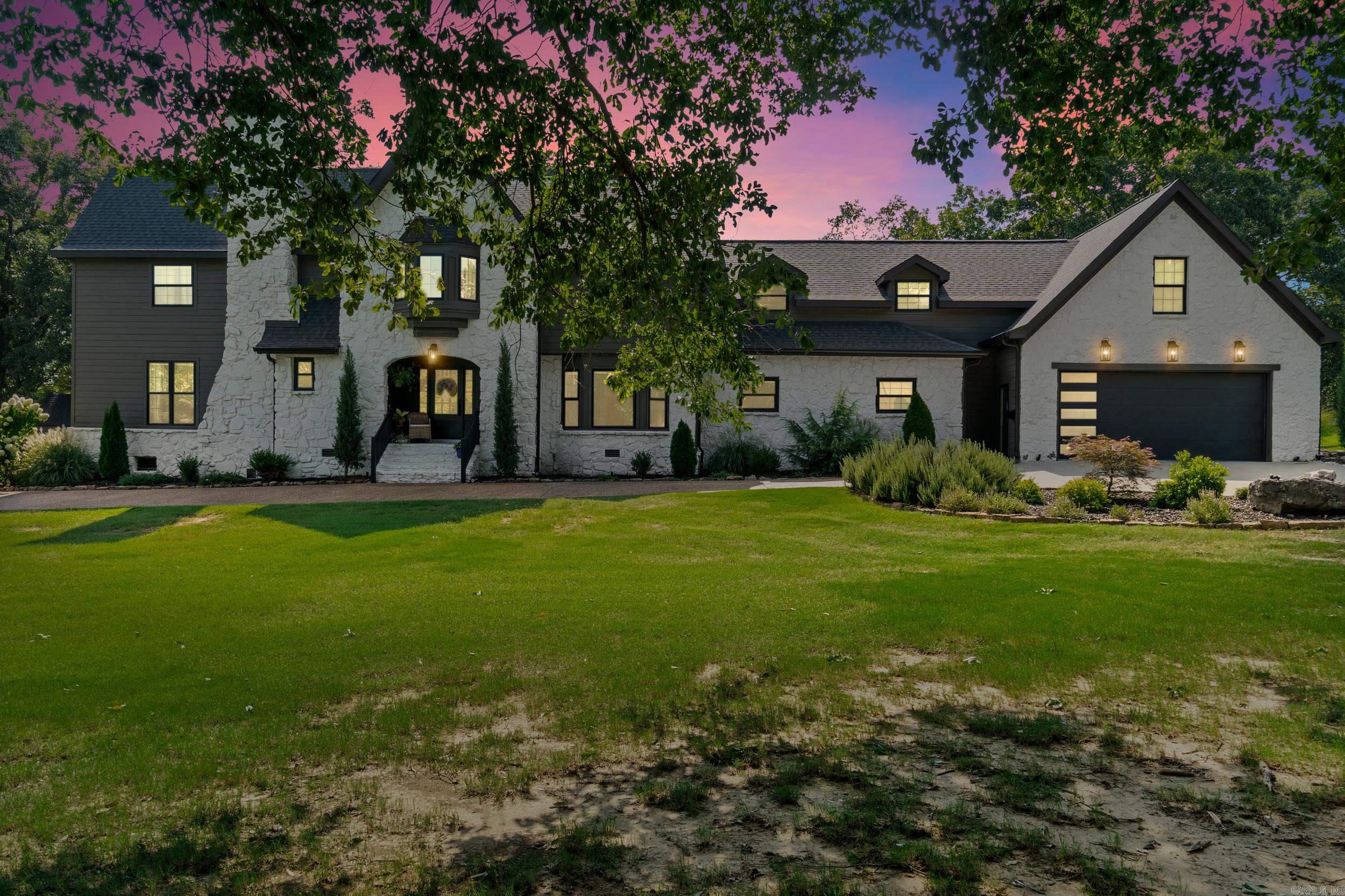 Welcome to this beautifully remodeled modern European home overlooking the 11th hole of the golf course in one of Searcy's most desirable neighborhoods.  Originally built in 1977, this impressive estate has been extensively updated while maintaining its timeless character.  This home features 6 spacious bedrooms and 3.5 baths with nearly every room being thoughtfully renovated.  This home features a chef's kitchen complemented by a private skullery/prep kitchen that can be closed off.  Flexible floor plan includes a heated and cooled space off the garage perfect for a home office, fitness space or hobby room.  Step into the backyard retreat featuring a large living are with fireplace, kitchen and oversized pool. Modern updates, generous living spaces and resort living are included in this home that is set up for everyday living and unforgettable entertaining.
