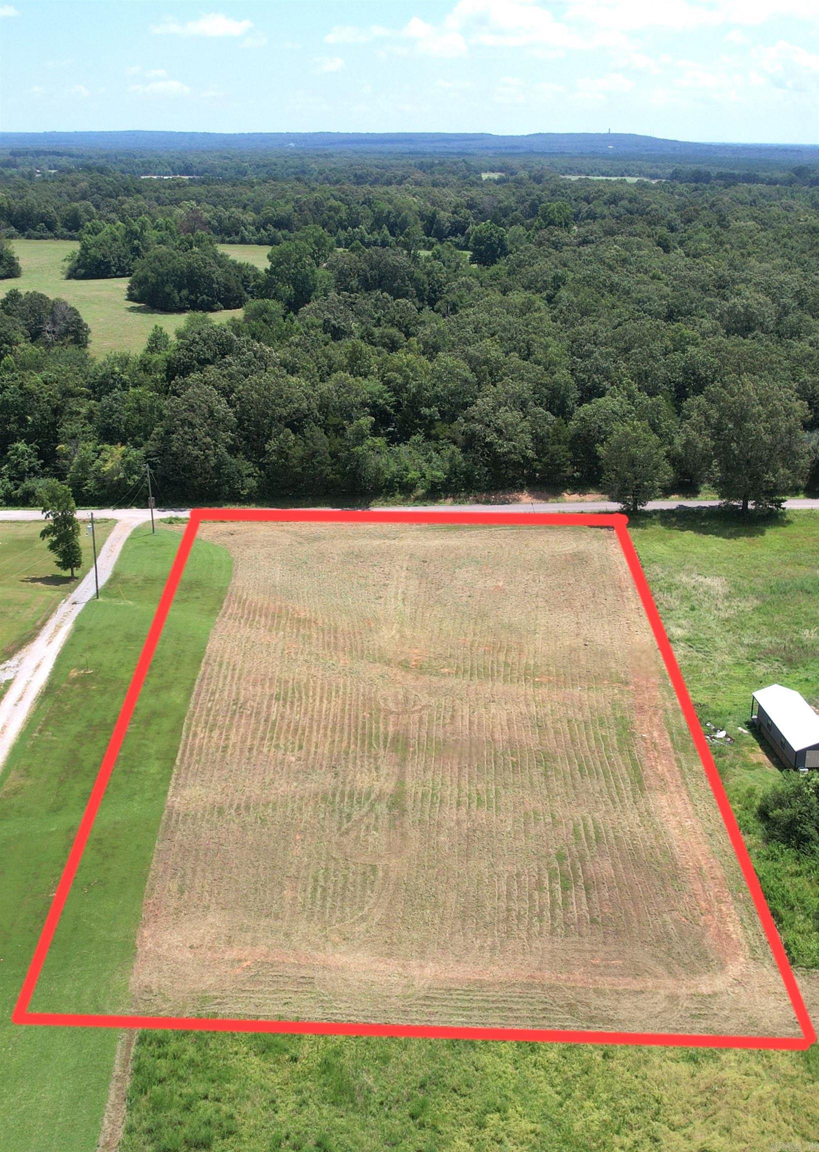 Great opportunity to own a  2-acre lot just outside of Searcy. Located in a quiet country setting with convenient access to town — approximately 9 miles / 14 minutes to Searcy, and within about an hour of Conway and Little Rock.  This gently sloping property offers a versatile setup with no known restrictions, making it a great option for a site-built home, mobile home, or RV setup, with room for a shop as well. Electric and water are available at the road, and the property has an existing septic approval/permit on file.  New survey completed, property corners marked, and ready for your build or setup.