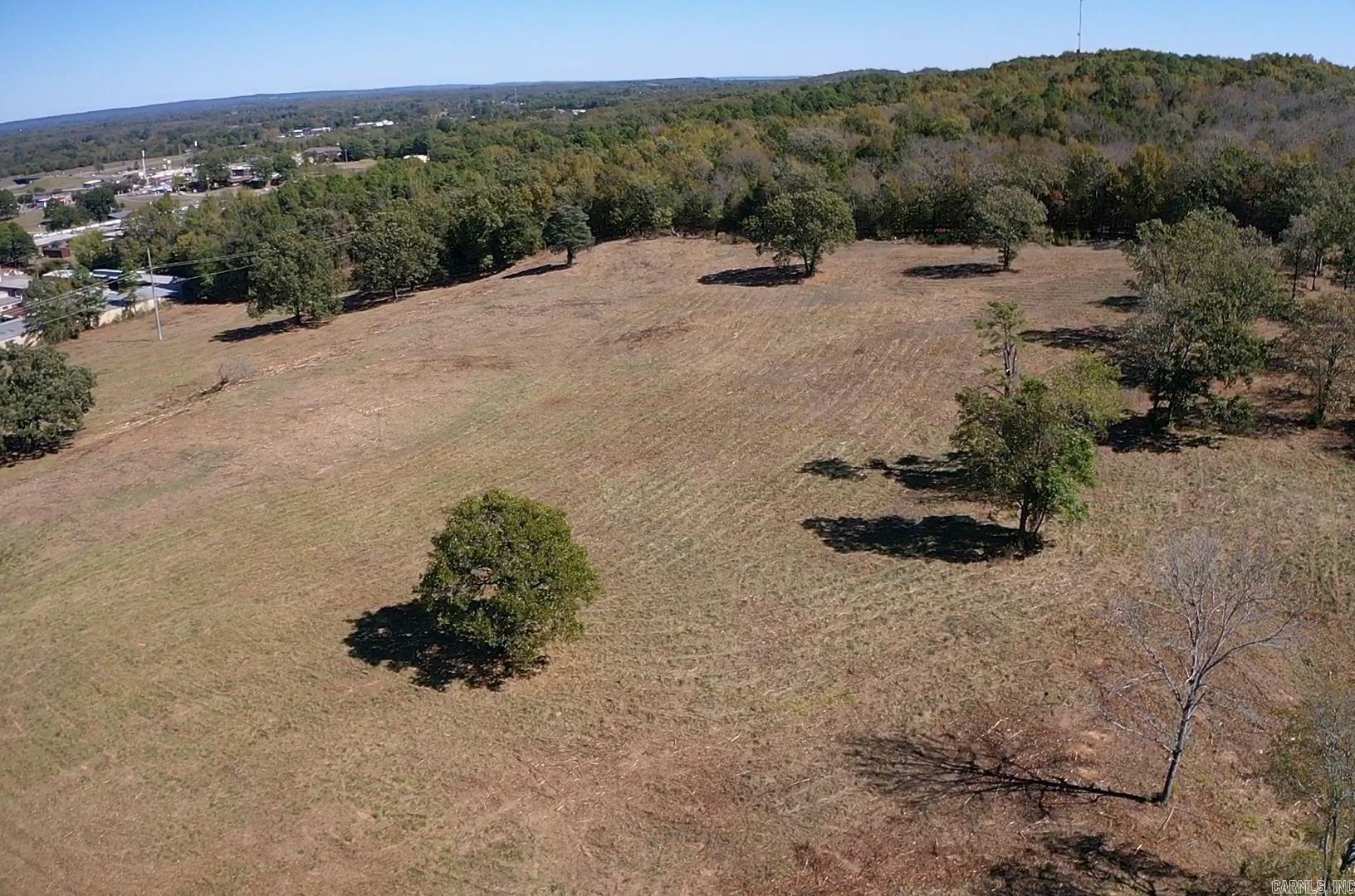 Investors, Builders, & Developers!  Explore the potential of this 11.52-acre residential property in Morrilton, AR. It also presents the potential for commercial rezoning, making it an ideal investment opportunity. The property is completely open and free of existing structures, giving you a blank canvas to bring your development ideas to life. With its unlimited potential, your creative vision will develop and make your dreams a reality. Ideal for a range of ventures, such as creating a stunning residential community or apartments tailored for a vibrant college town.  Additionally, there is an extra 8.33 acres allocated for prime commercial use, making a total of 19.85 acres available for purchase. The property features breathtaking topography, offering picturesque views that enhance its appeal. Located on HWY 9 and less than 3 minutes from I-40, this site ensures excellent accessibility for residents and businesses in Russellville, Conway, and the Greater Little Rock area.  Do not miss this rare chance to invest in a thriving location with limitless potential!