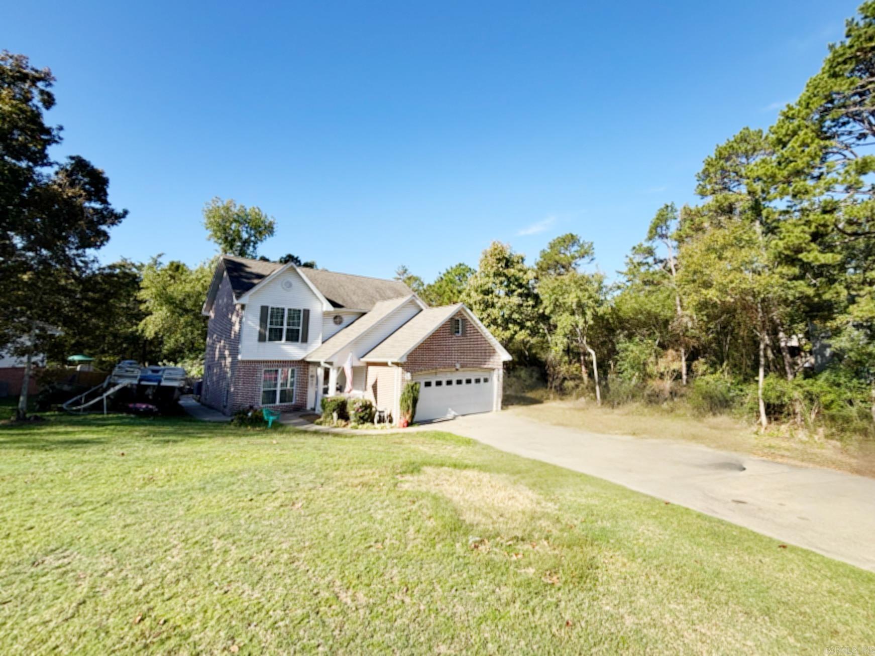 Acreage is approximate from the seller. This home has a lot to adore!! Two stories with a large deck in the back built around a large above ground pool that with a little love, will be ready for summer, two car garage, Gas log fireplace in a spacious family room, Tile showers in all 3 bathrooms with lots of storage throughout the home and an remote controlled lift up the staircase! Conveniently located in the heart of Heber Springs, close to the gorgeous Greers Ferry Lake, the Little Red River and everything Heber's Business district has to offer! Home is being sold as is. Agents see remarks