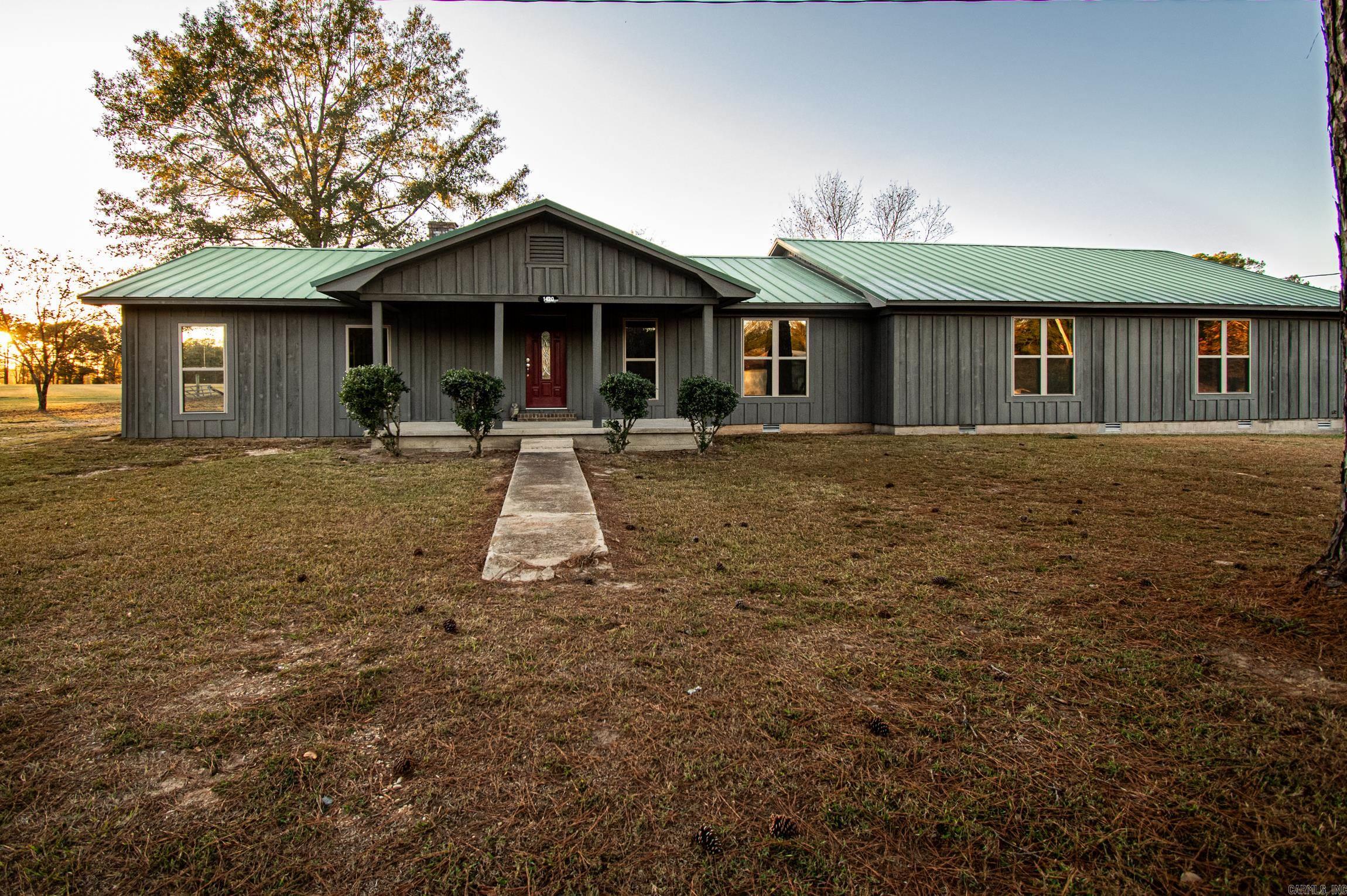 This spacious remodeled home is everything you need and more. 4 bedrooms, 2 bathrooms, and a huge laundry room. Brand new hardwood floors, Drywall, cabinets, paint and more.  Conveniently located on Highway US 63, it makes for an easy drive to work in all directions.