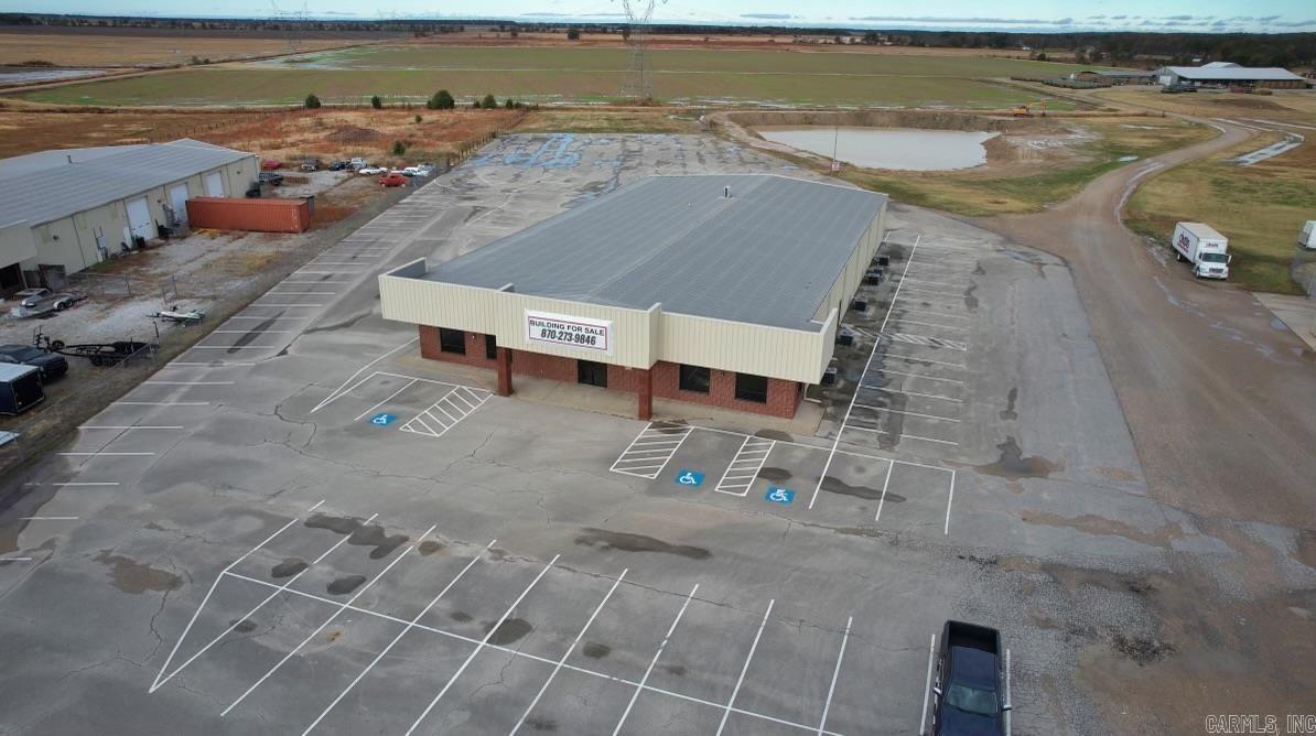 Opportunity awaits on this huge commercial building just outside city limits. Over 12,000 square feet of office space is ready for its next owner! Building also includes 180 parking spots and sits on 3+ acres.