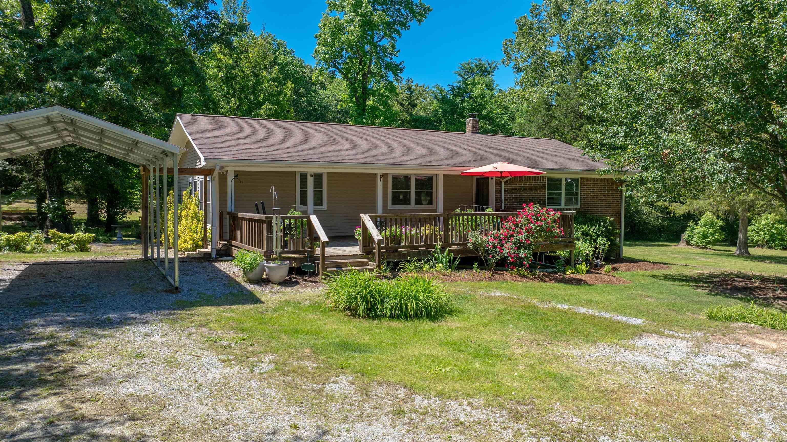 Welcome to the market this well-maintained 3-bedroom, 1-bath home located in the desirable Cord community. Situated on approximately 20 acres, this property features a beautiful mix of open yard space and wooded acreage, along with a large pond, making it ideal for outdoor living, recreation, or homesteading. The home is serviced by city water and also includes a well on the property. Recent updates include a new HVAC system and water heater installed in 2025. Additional features include a large shop building and a fenced garden area designed to help keep deer out. A new survey was completed in 2024. If you have been searching for peaceful country living with room to grow, this is a property you do not want to miss. Call today to schedule your private showing before it is gone.
