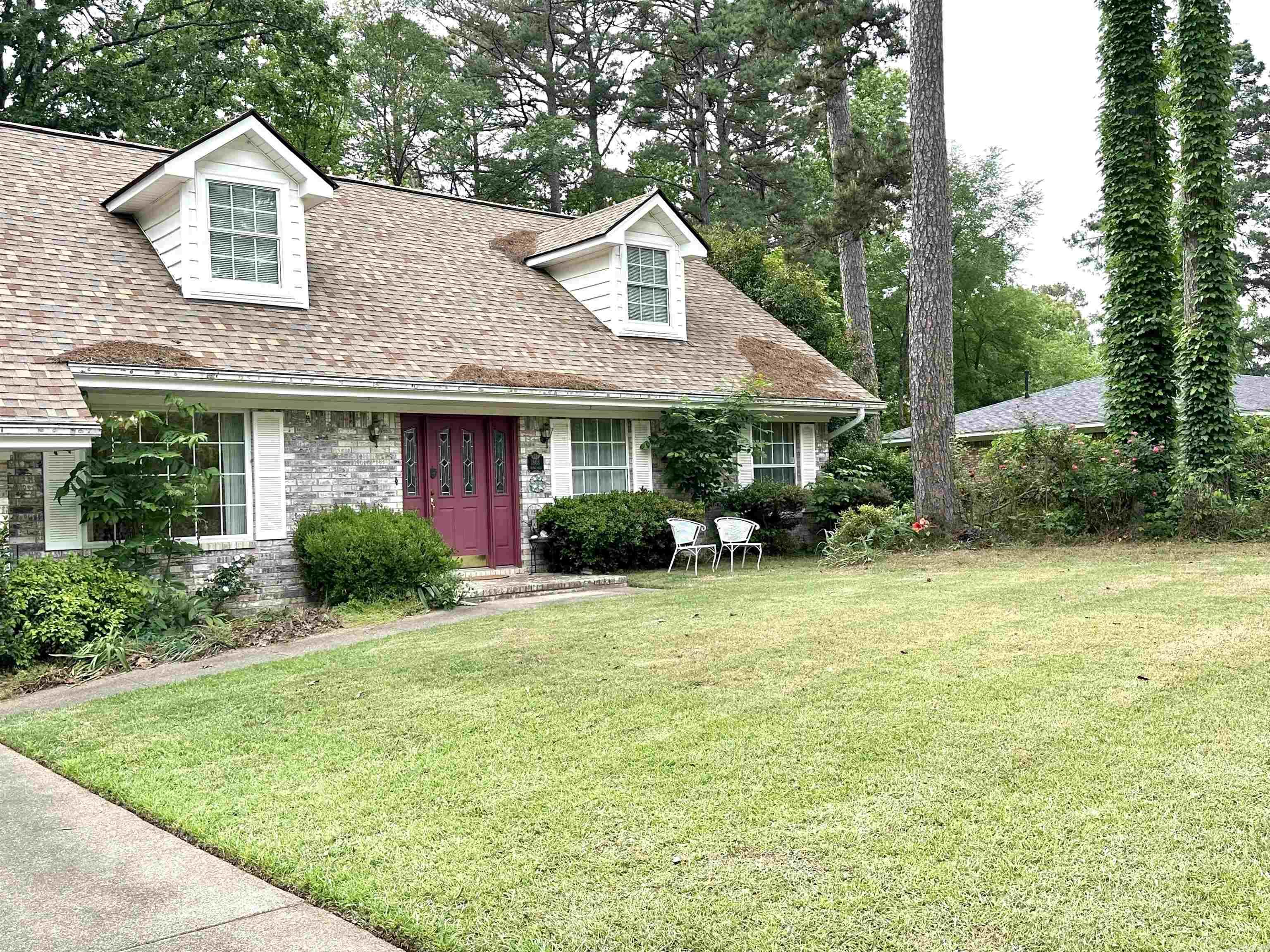 Some of the best living in Malvern city limits outside, Royal Oaks Subdivision. This 2 story home comes with lots of love, a new roof and a neighboring vacant lot designated as a Overton Park. Dual zoned HVAC systems, formal living & a large den with wood burning fireplace (gas insert presently)  for two living spaces on either end of the first level. Eat in kitchen plus dining area connecting kitchen to front entry. Primary bedroom with bath on the main level. 3 car garage with tool room & 2 auto roll up doors. Solid build cutsom home with large covered back porch facing a wooded view. Chain link fenced dog run or garden space, let your imagination go! Priced under recent sales for buyer to replace flooring and spruce up after close, no need to deduct from price it has been done for you. Extra adjacent parcel 120X150 included, parcel #700-05821-000, this has monument for Overton Park and very special. Total of .81 acre included in this price.